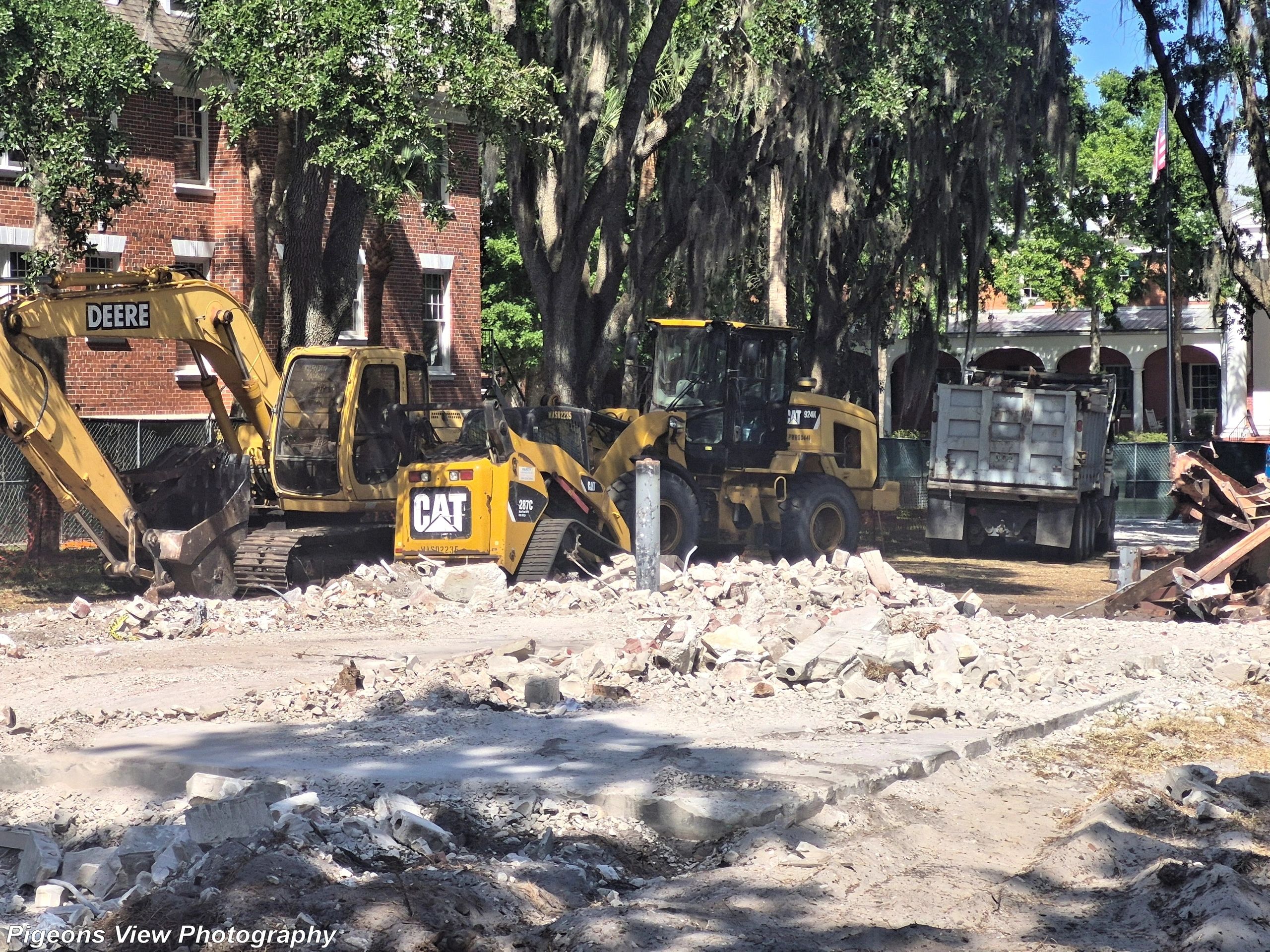 Excavators and dump truck at work