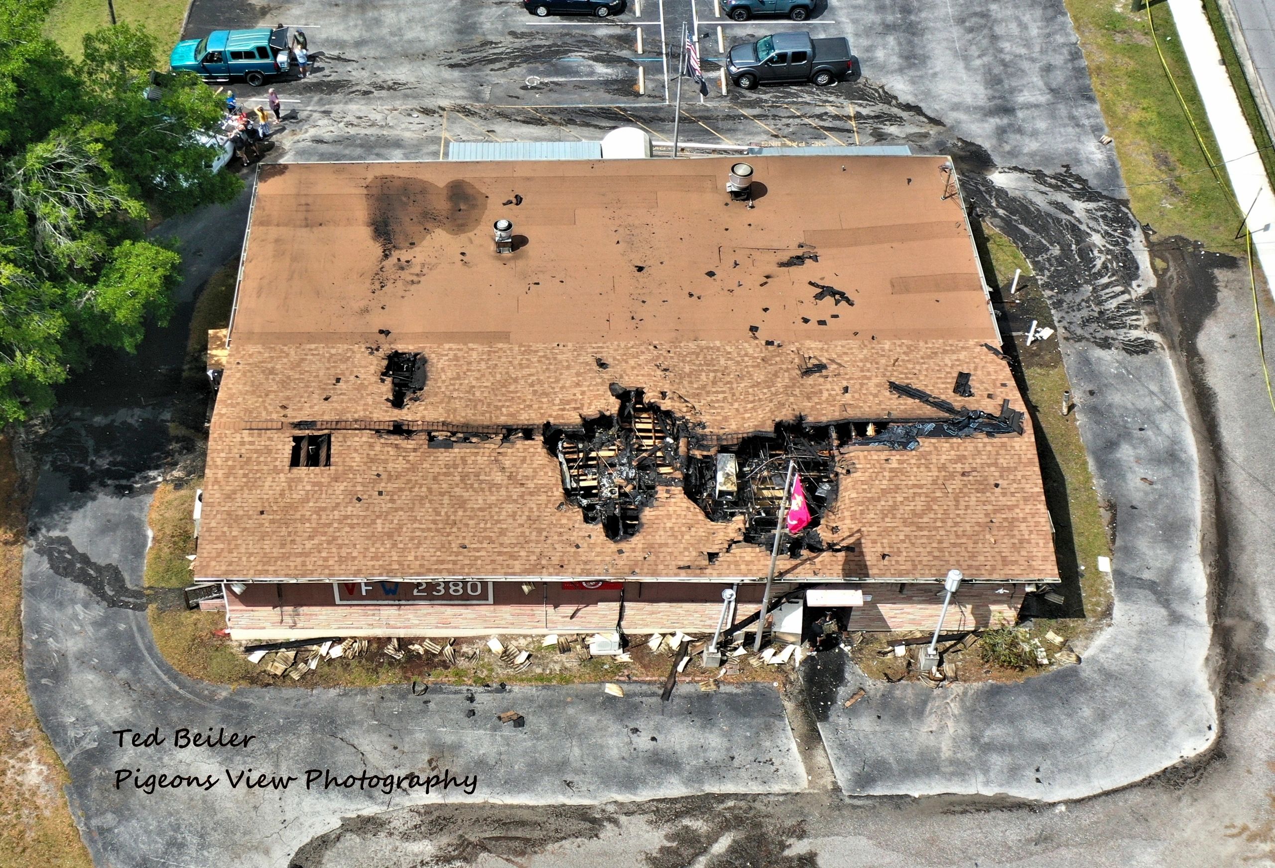 Building roof with significant fire damage.