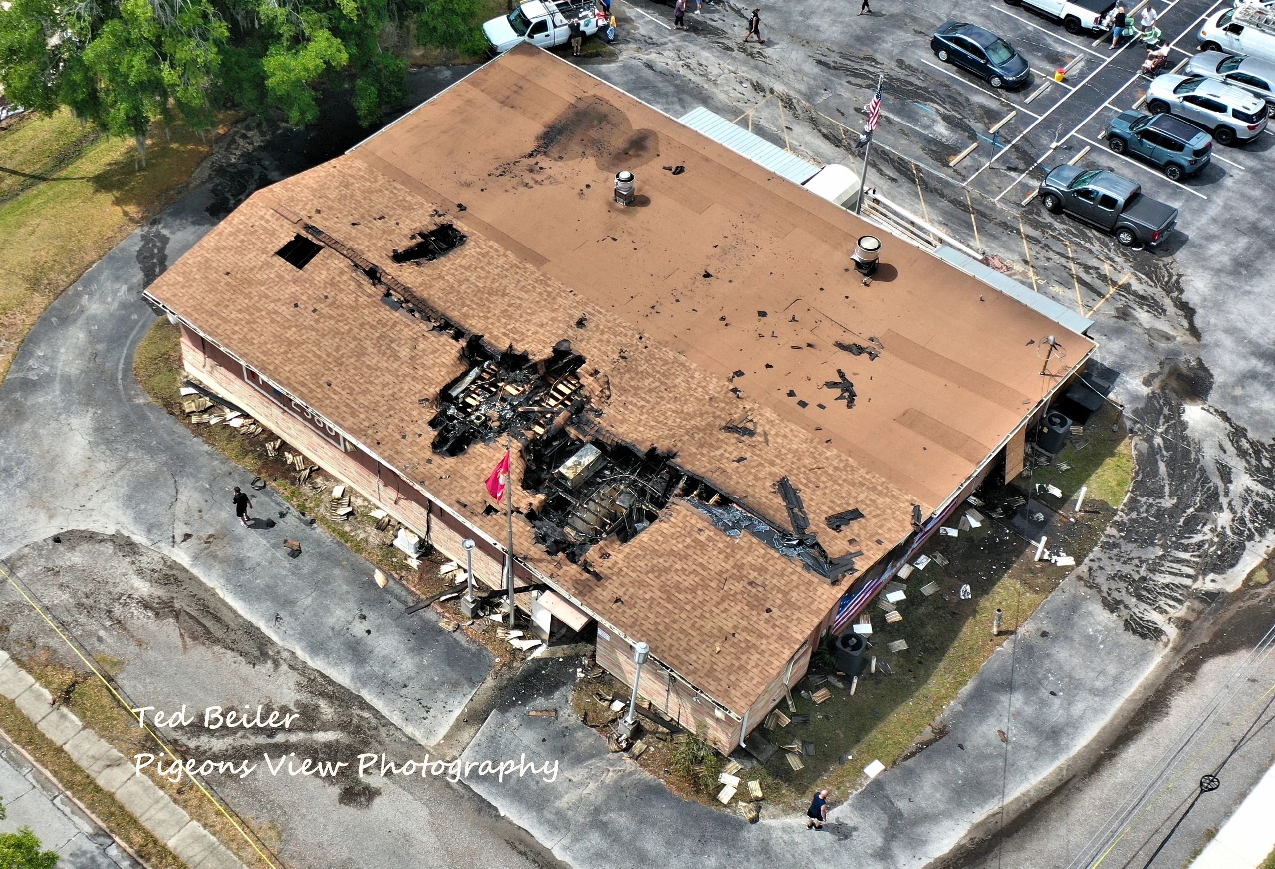 Building with fire damage aerial view