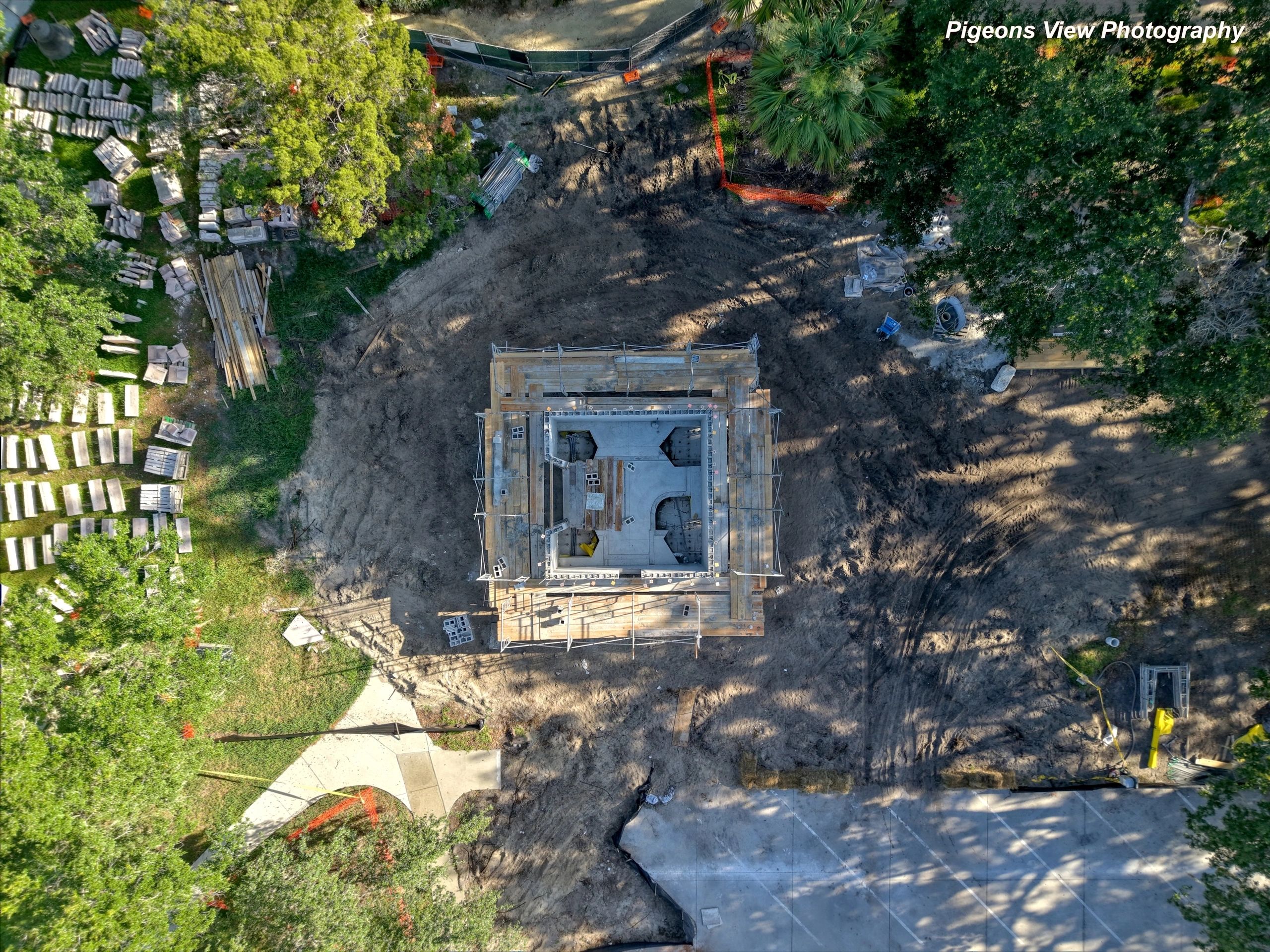 Construction site surrounded by trees