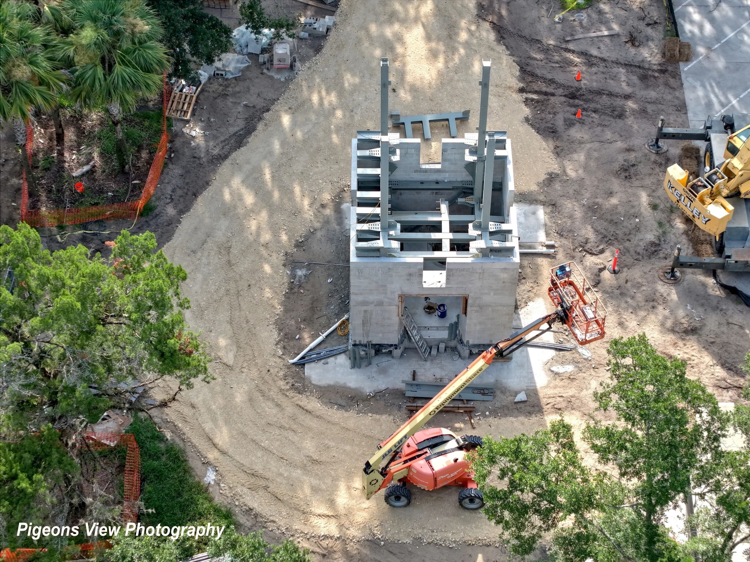 Workers operating machinery at construction site