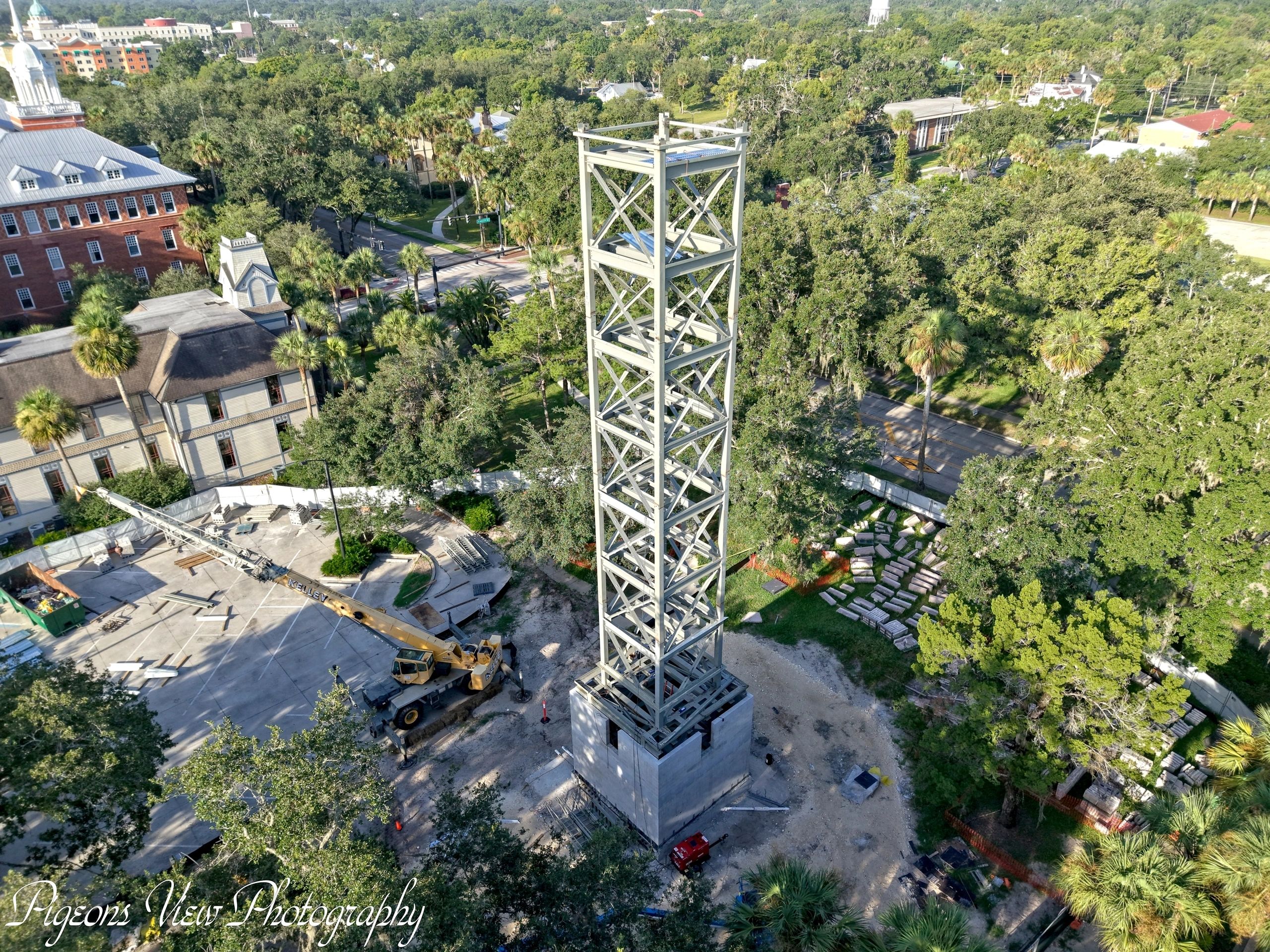 Tower framework among trees and buildings
