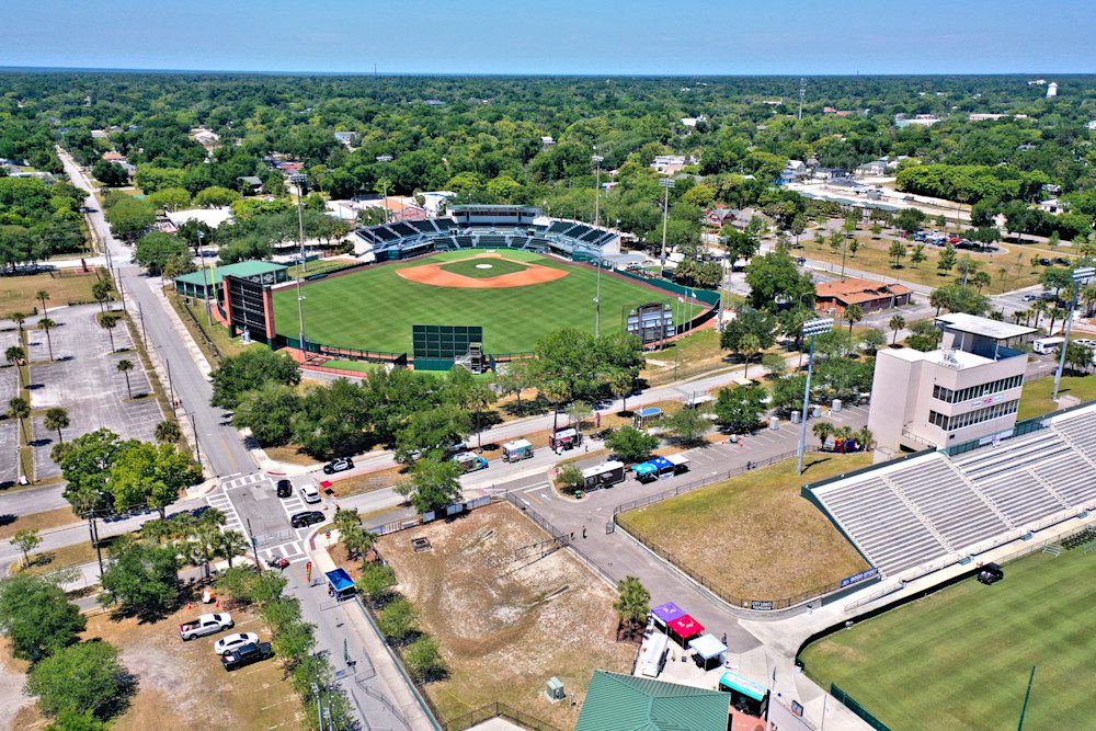 Baseball field surrounded by trees and roads