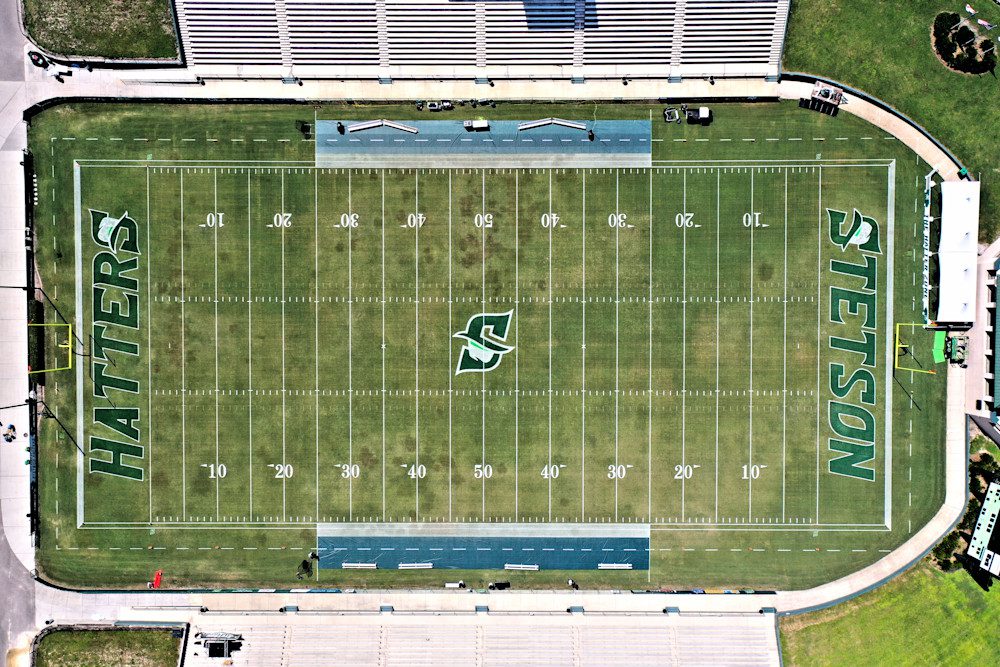 Empty football field with bleachers