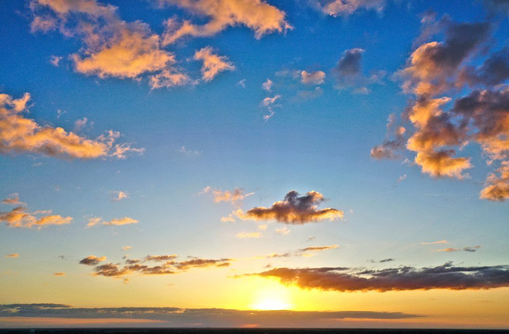 Vibrant sunset with scattered clouds