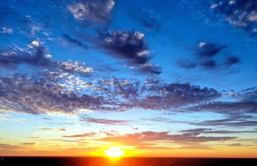 Vibrant sunset with scattered clouds