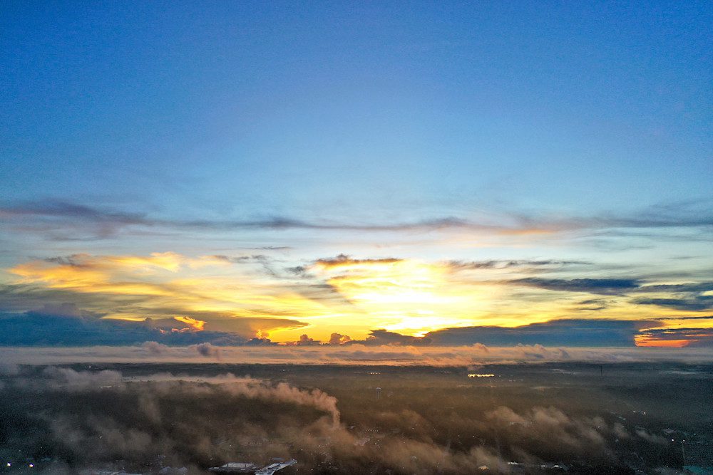 Sunset over a misty landscape
