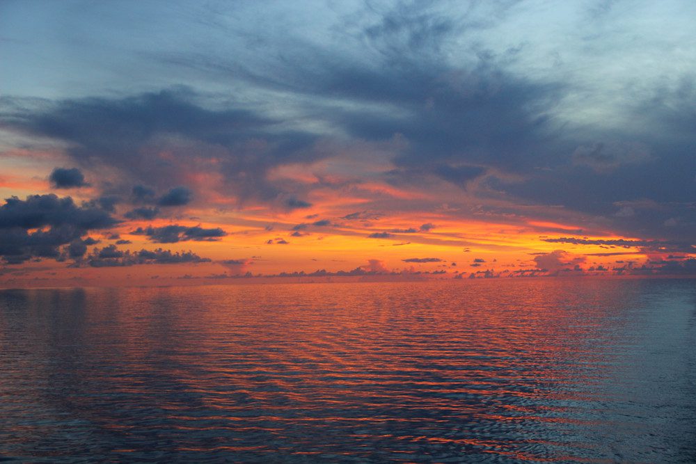 Dramatic clouds at ocean sunset