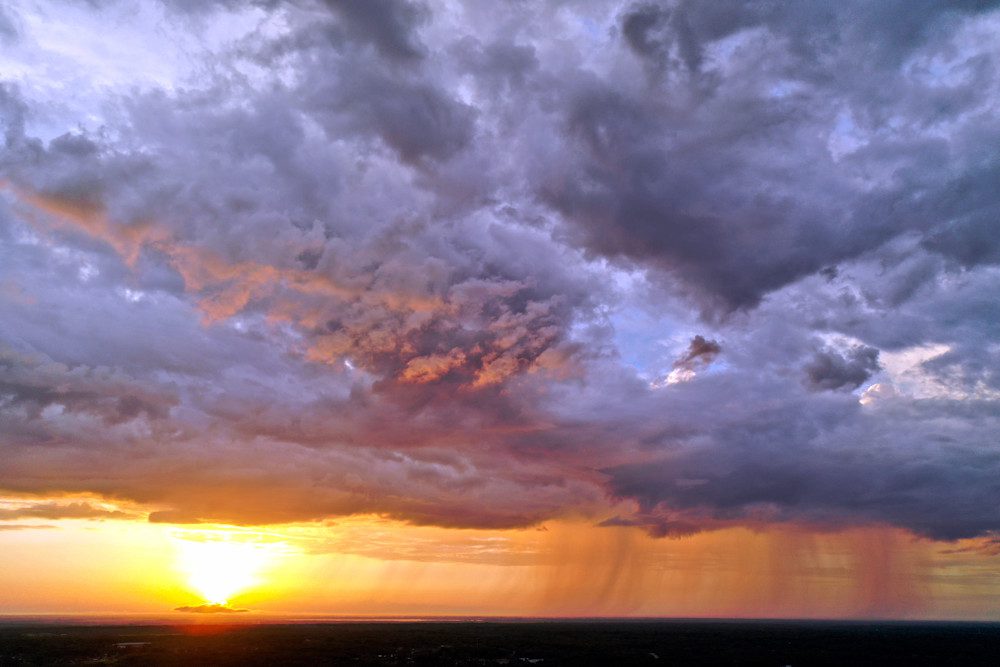 Sunset sky with rain and clouds