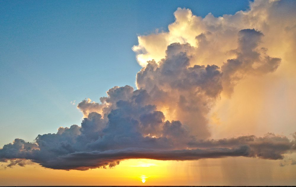 Dramatic clouds during golden sunset