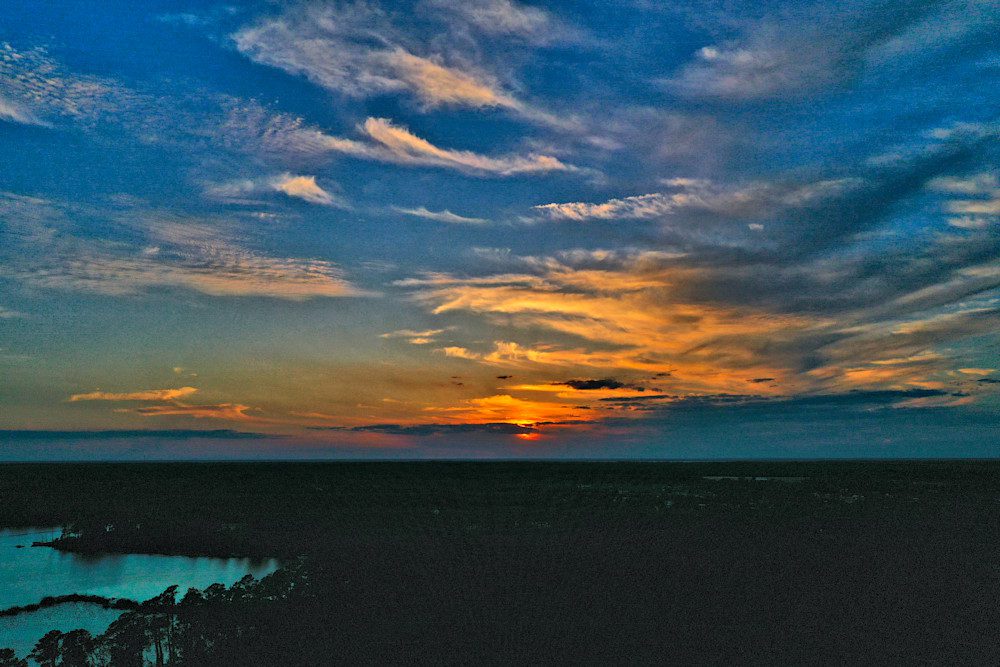 Dramatic sky at dusk with glowing sunset.