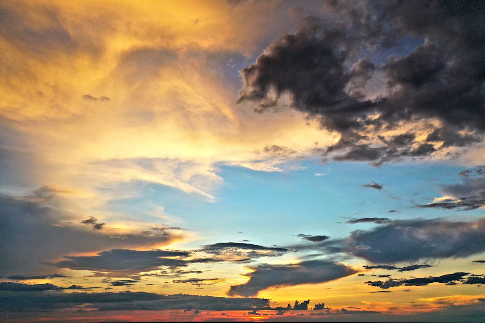Vibrant evening sky with dark clouds.