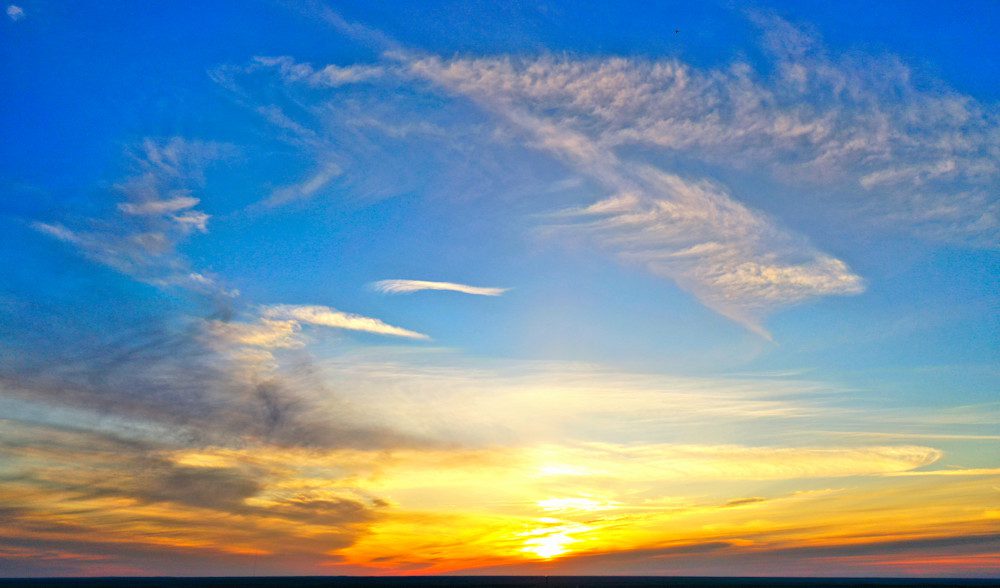 Colorful sunset sky with wispy clouds