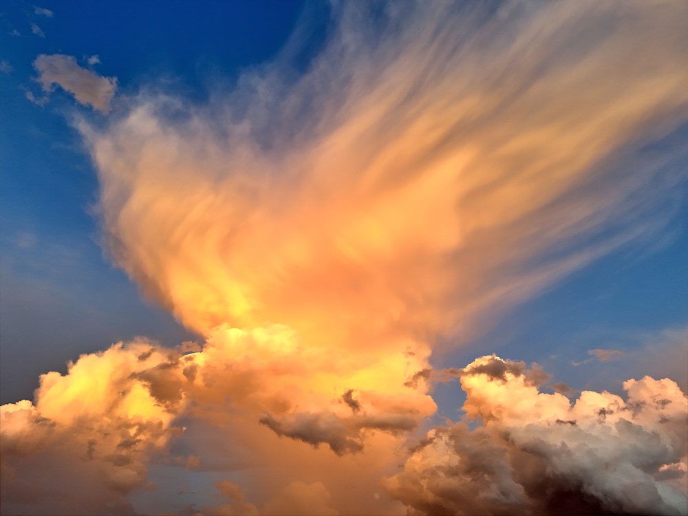 Dramatic sunset clouds against blue sky