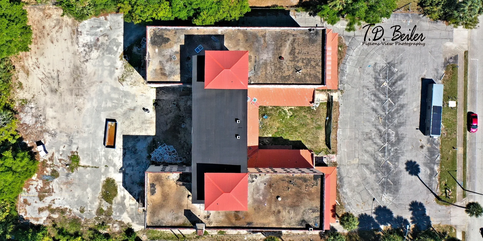 Overhead shot of building with red roofs.