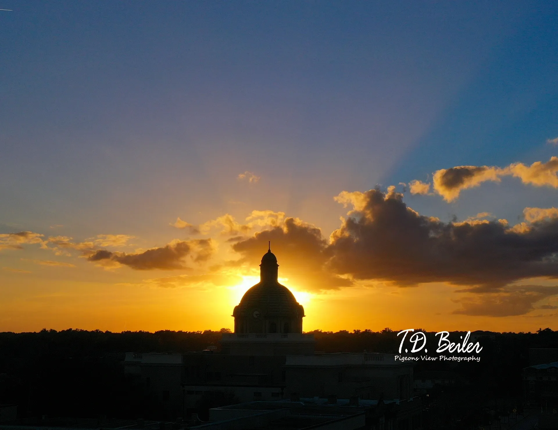 Golden sky with clouds and dome
