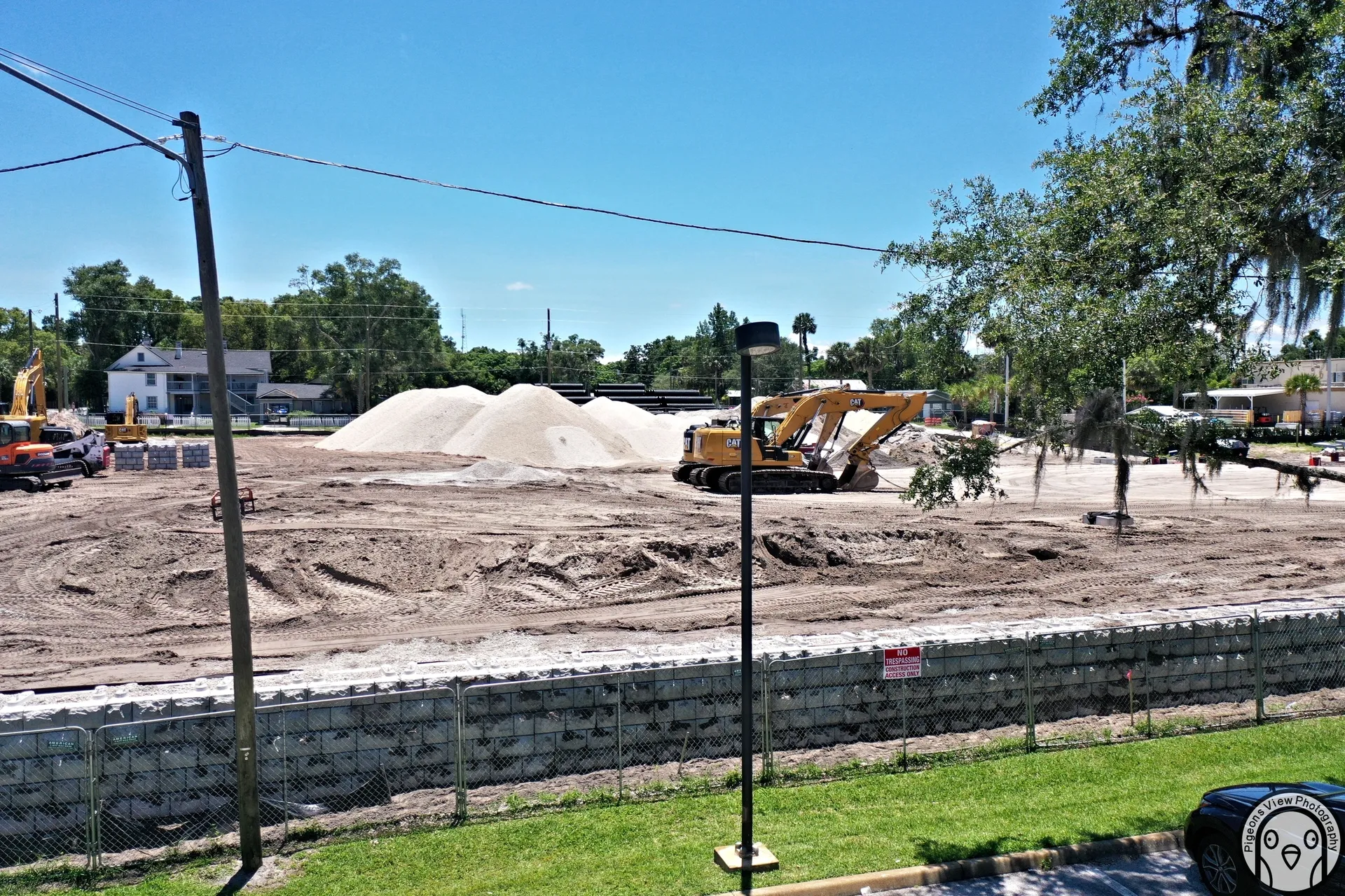 Piles of sand and machinery at construction site