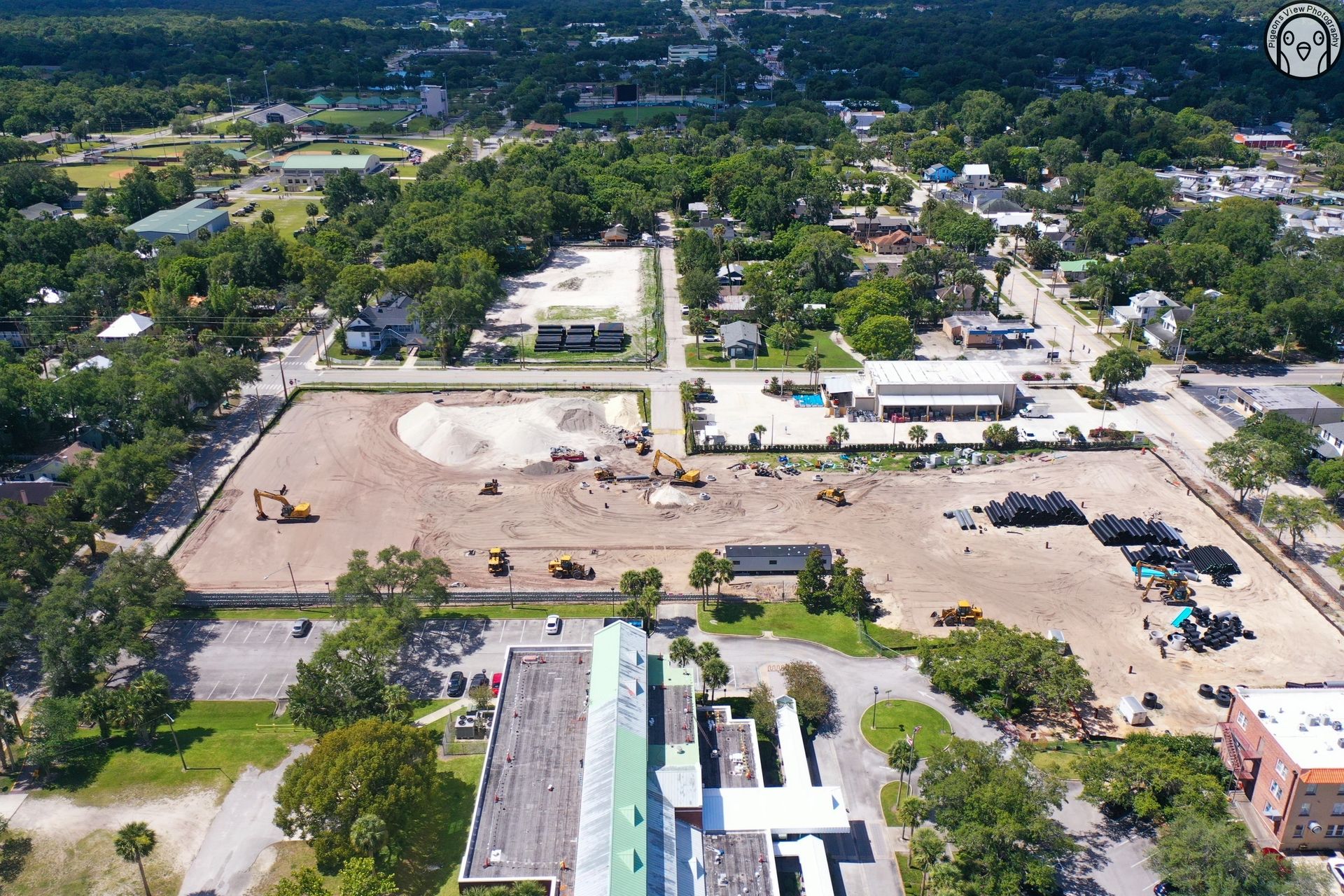 Urban construction project surrounded by trees