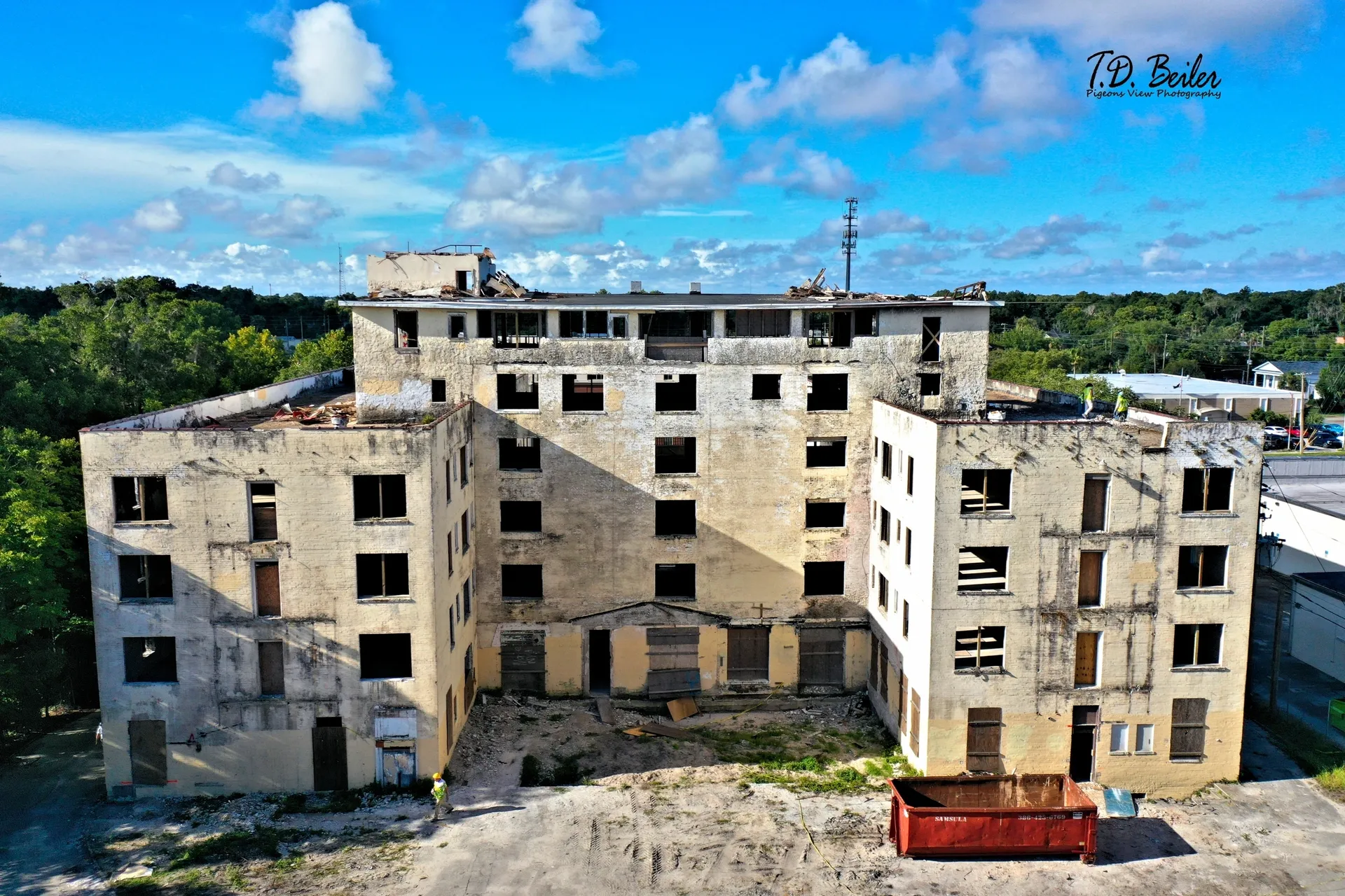 Empty five-story structure under clear sky