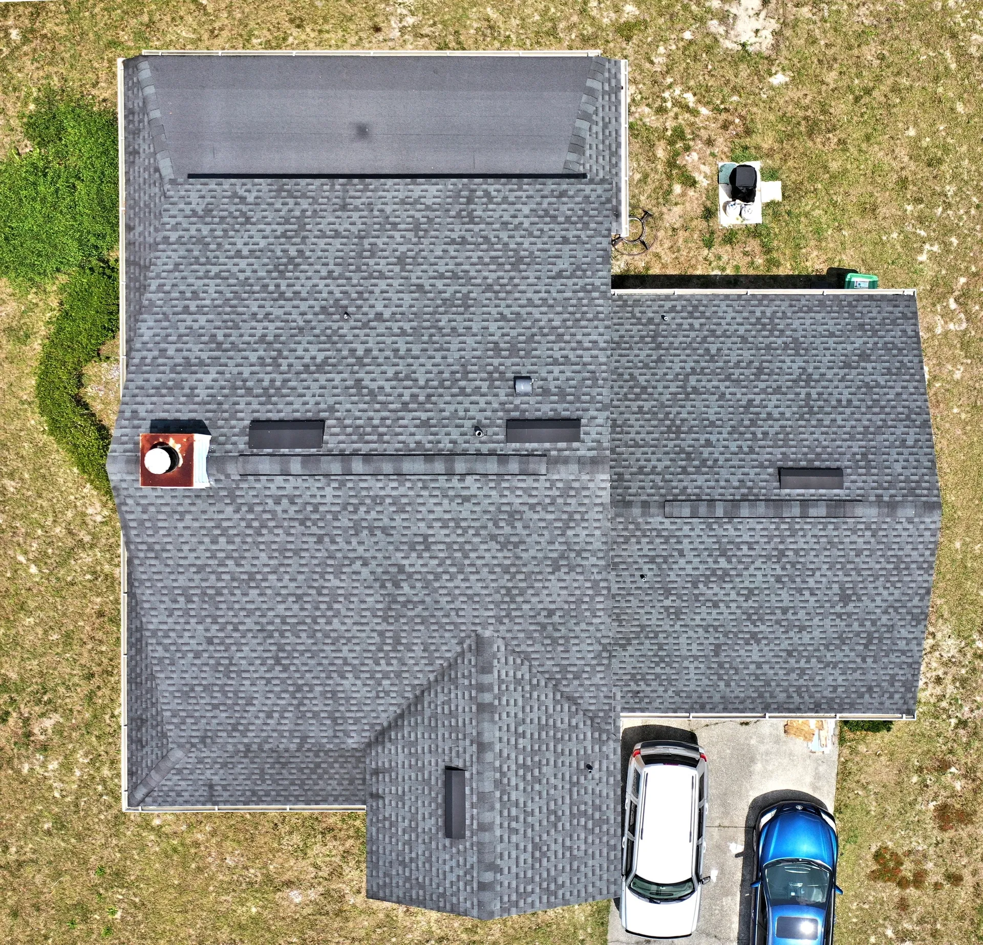 Aerial view of house roof and driveway