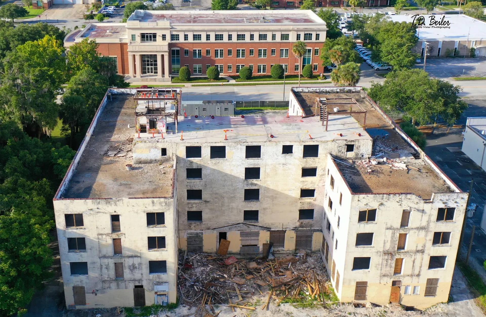 Abandoned building with debris and greenery