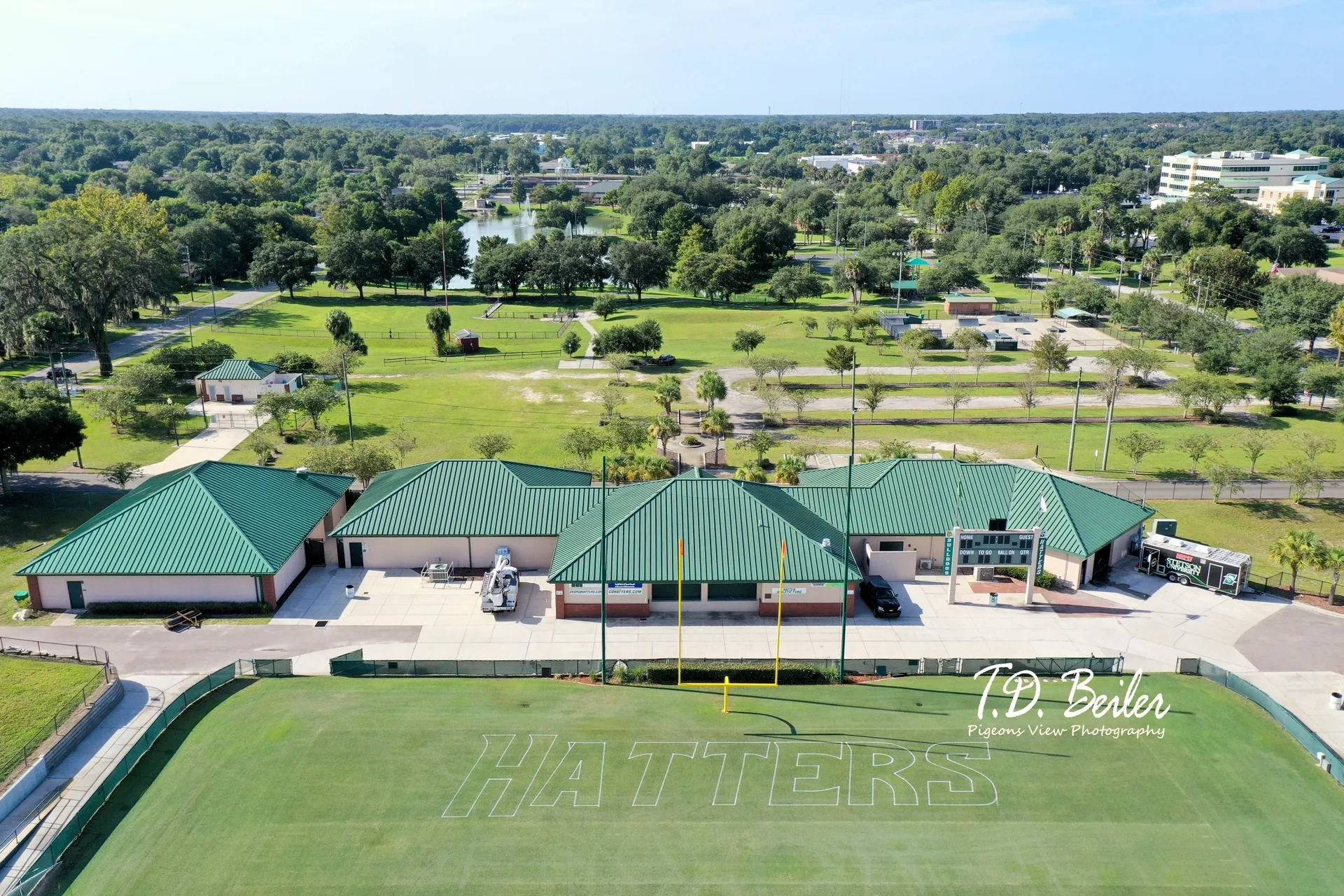 Green-roofed buildings near sports field