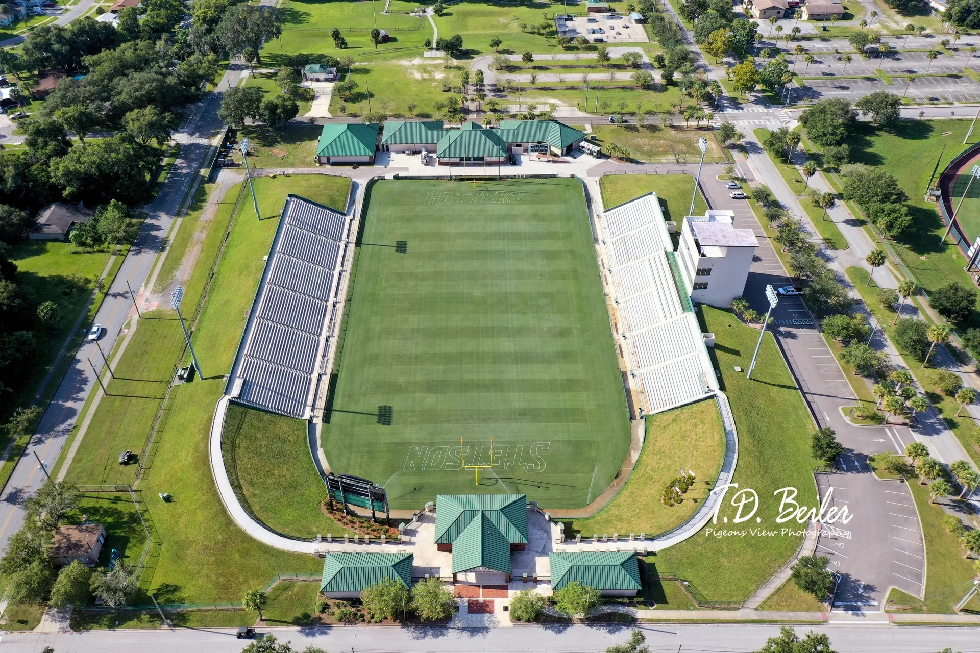 Open-air stadium surrounded by trees