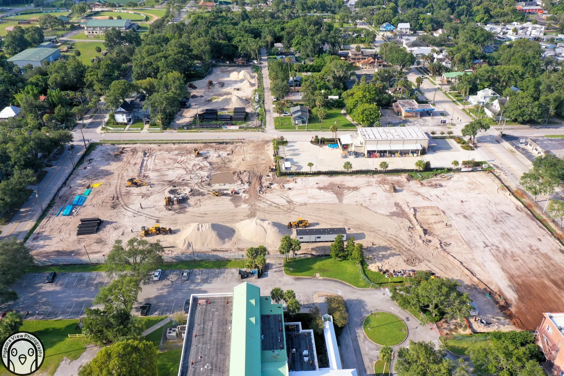 Construction site with heavy machinery aerial view