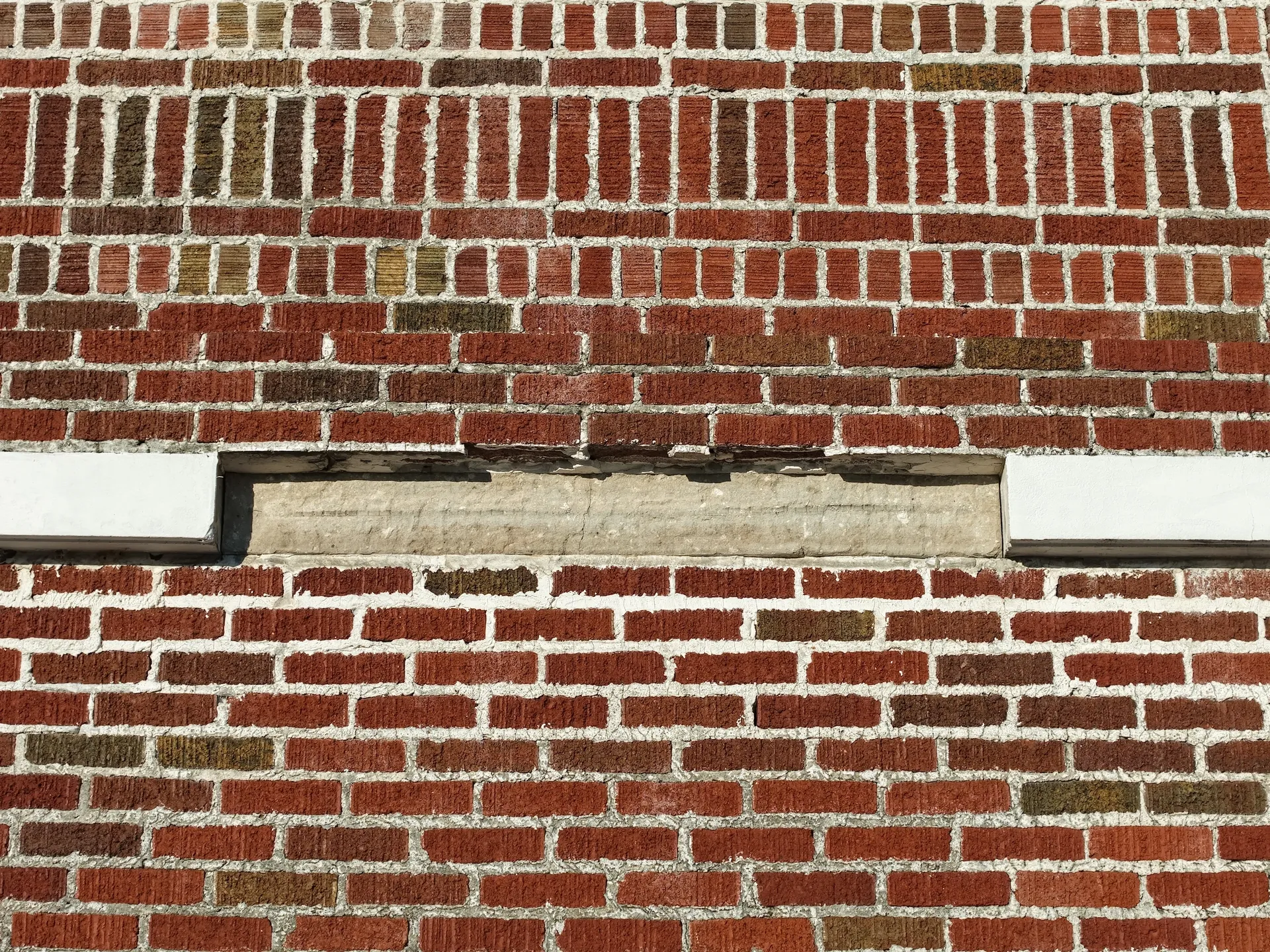 Brick wall showing uneven wear