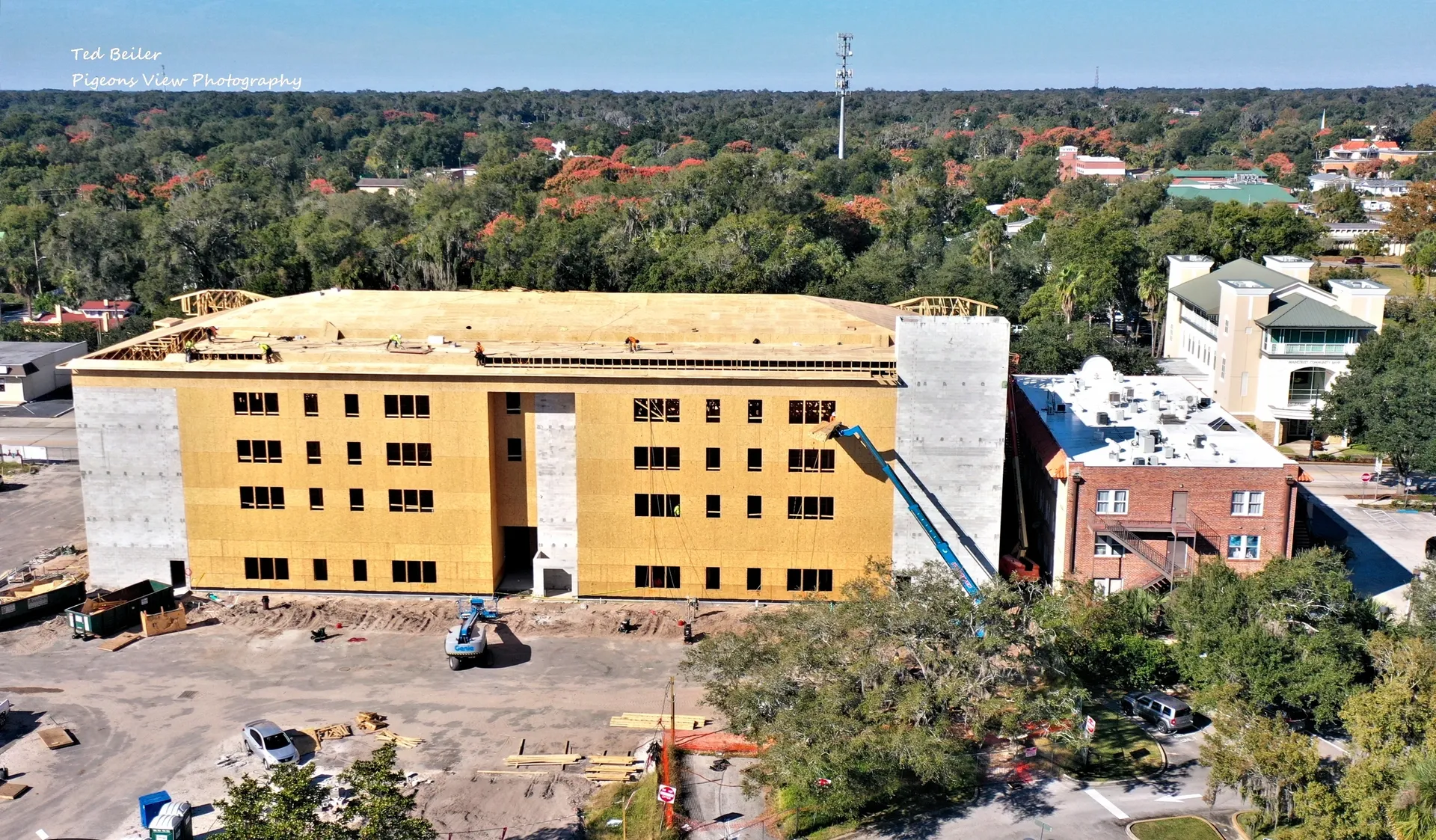 Construction site with large building aerial view.