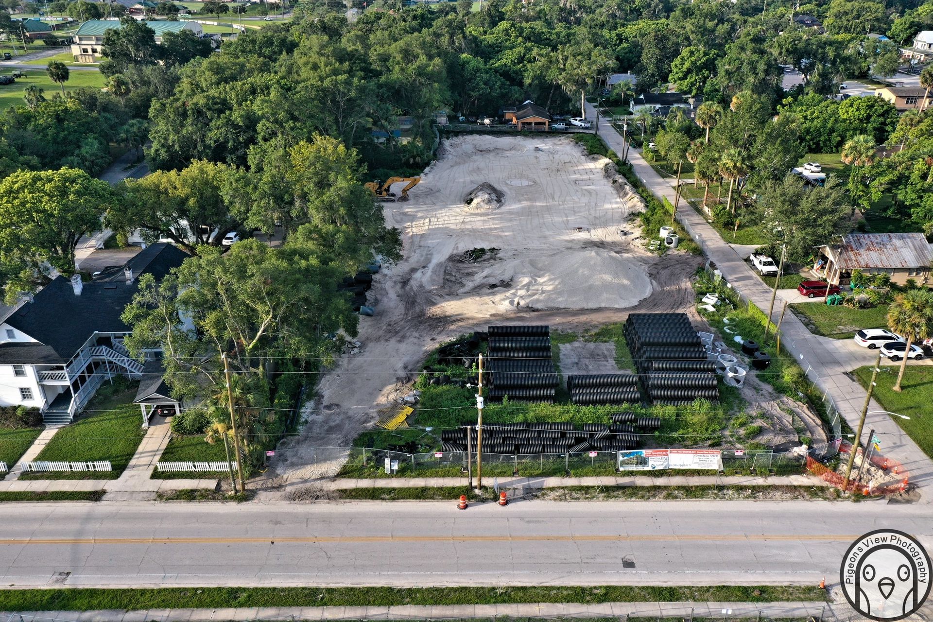 Construction site with trees and road