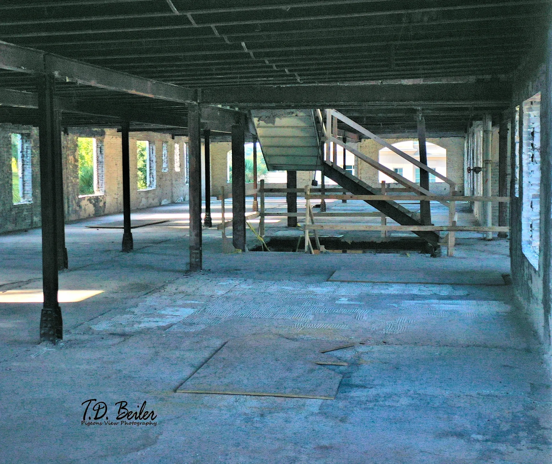 Empty industrial interior with exposed beams