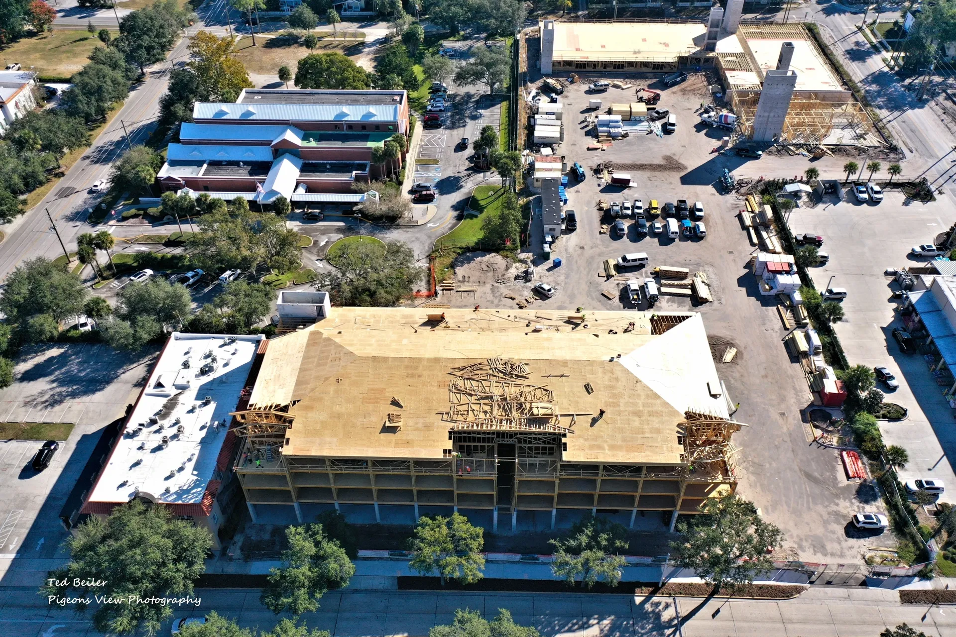 Building under construction with nearby structures