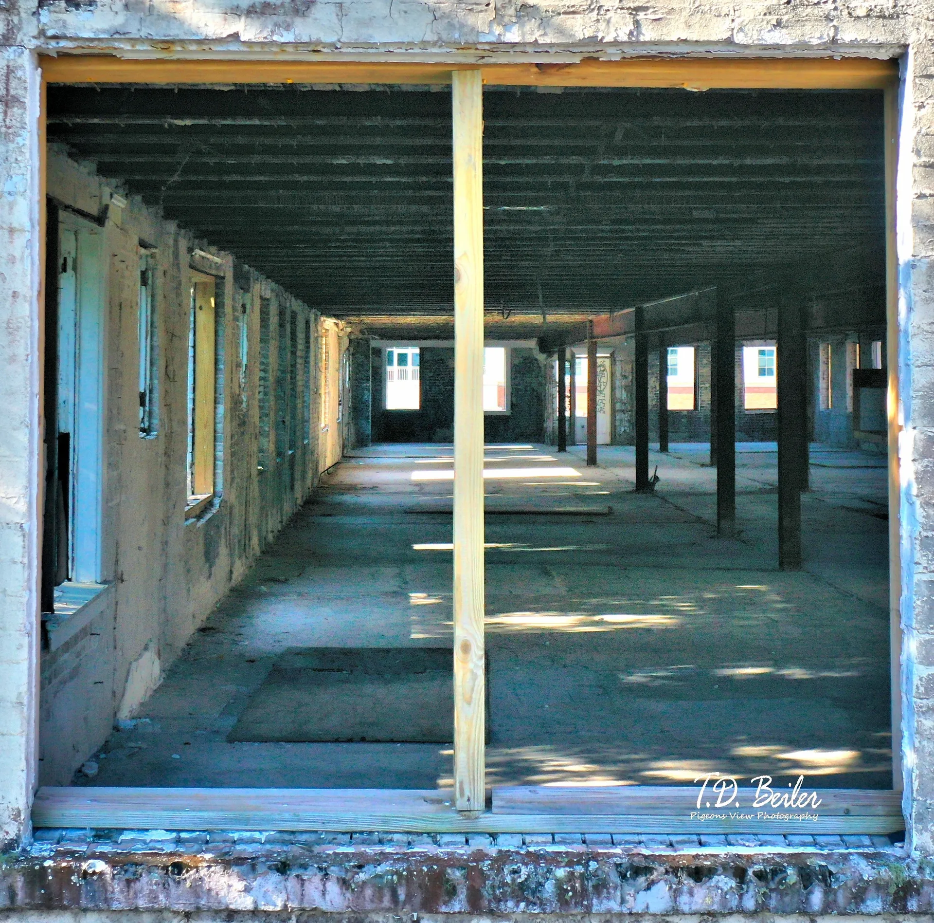 Empty warehouse interior with exposed beams