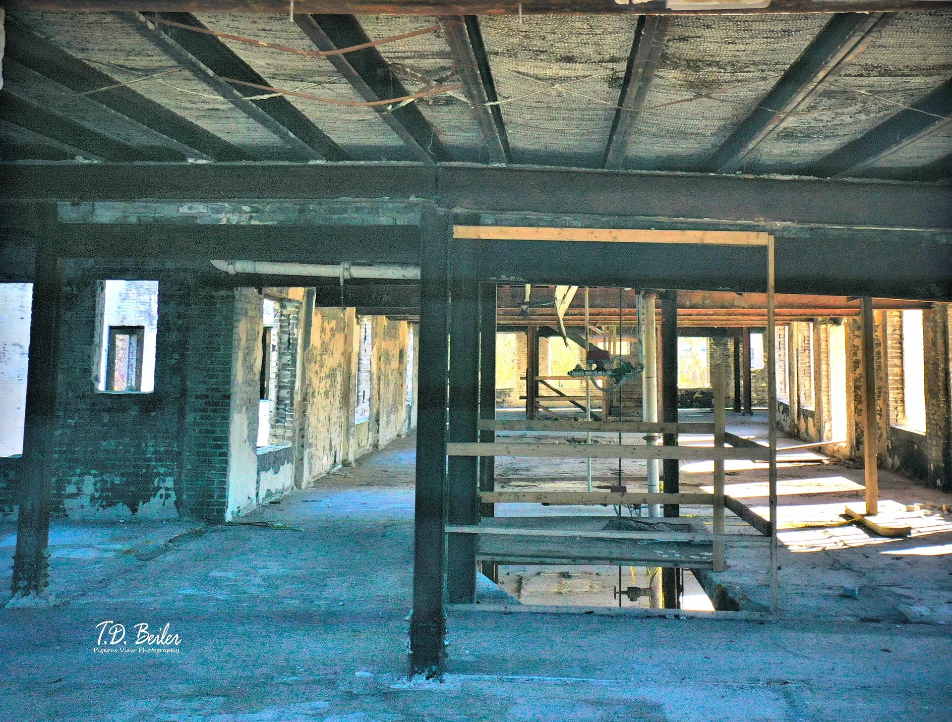 Abandoned building interior with exposed beams