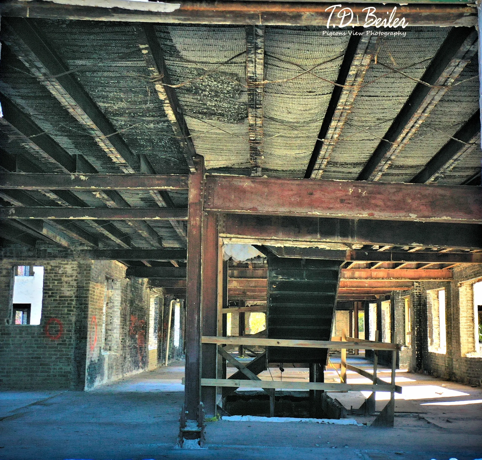 Abandoned building interior with exposed beams