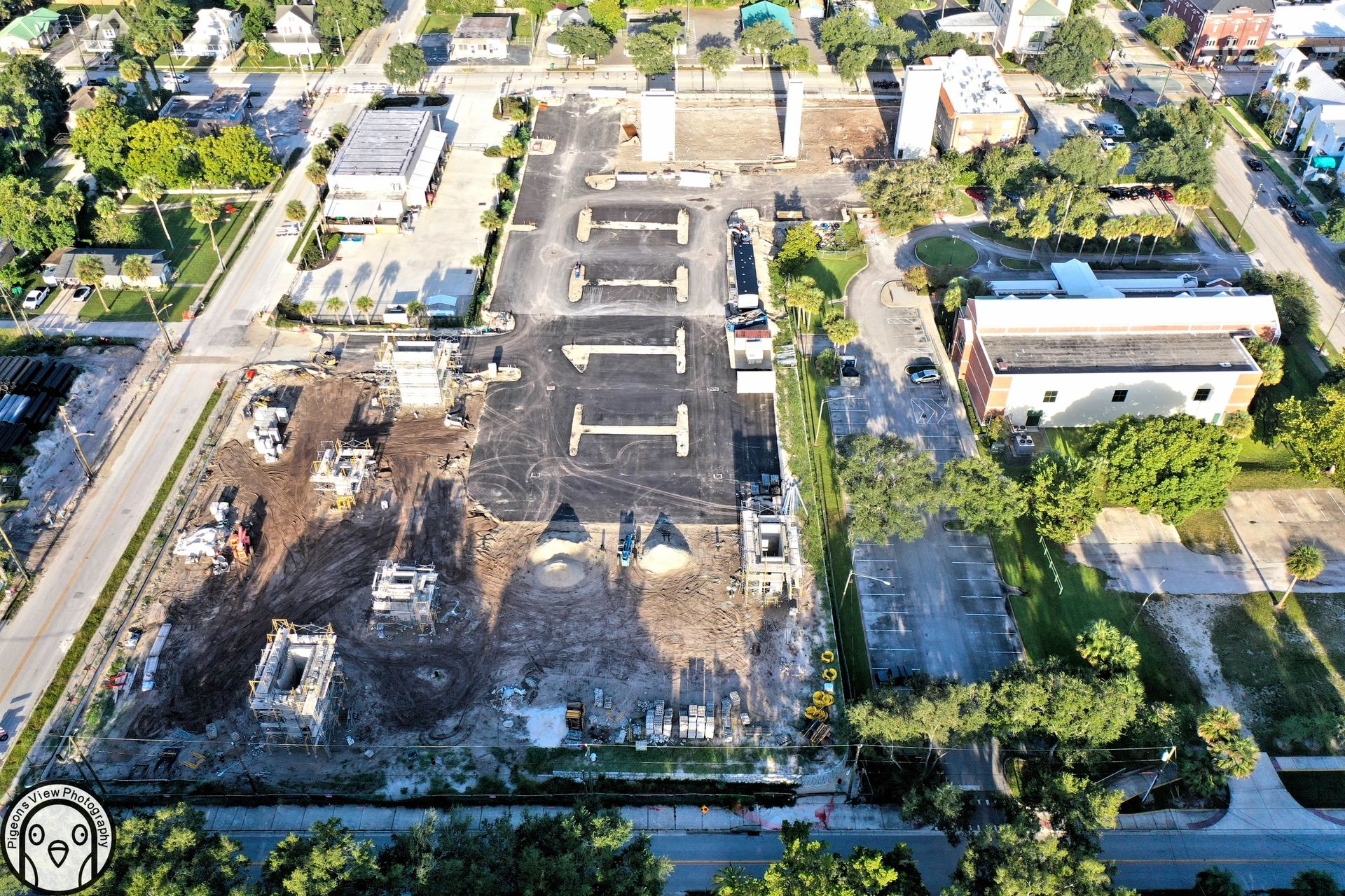 Building foundations and empty parking spaces highlighted.