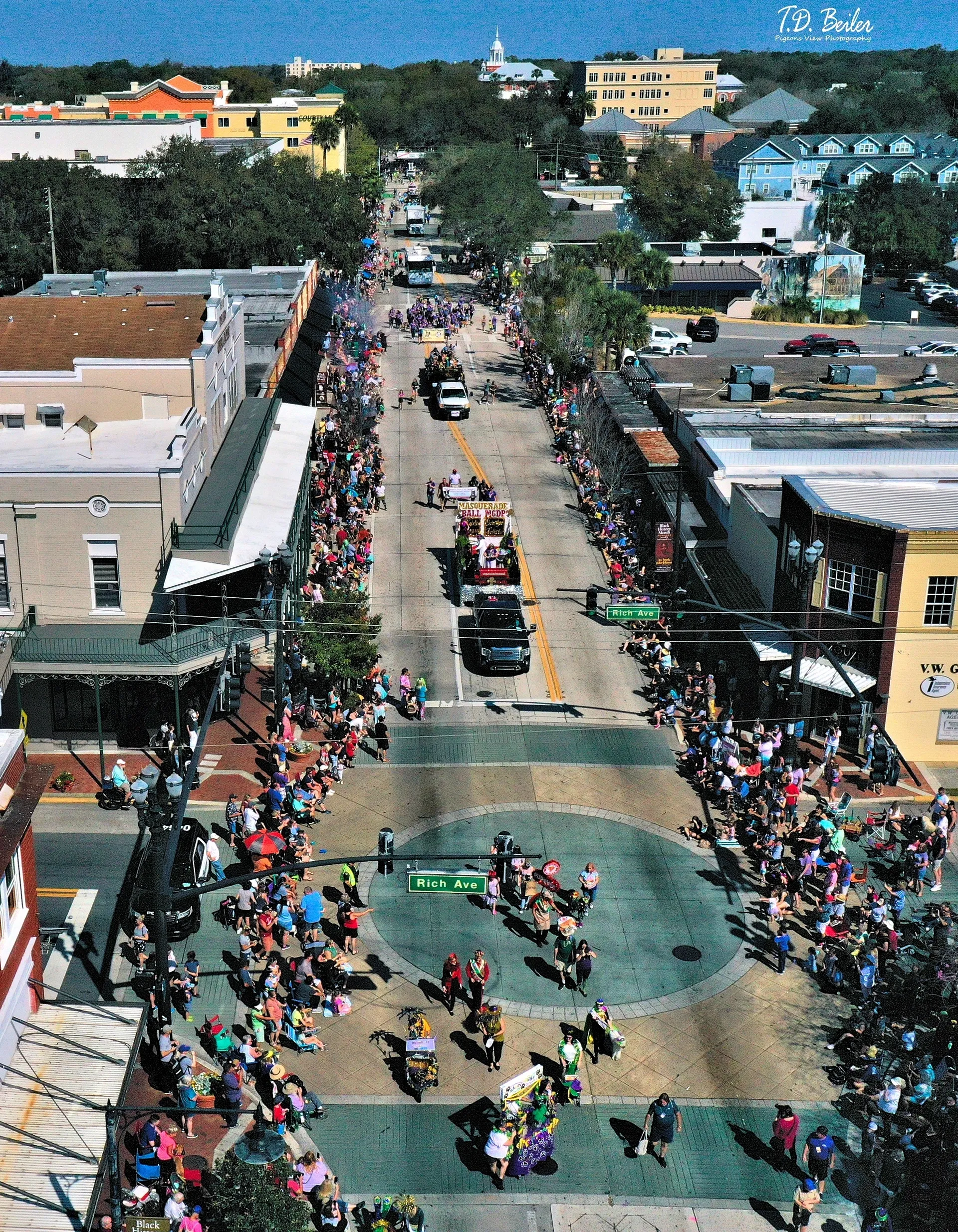 Aerial view of lively street parade