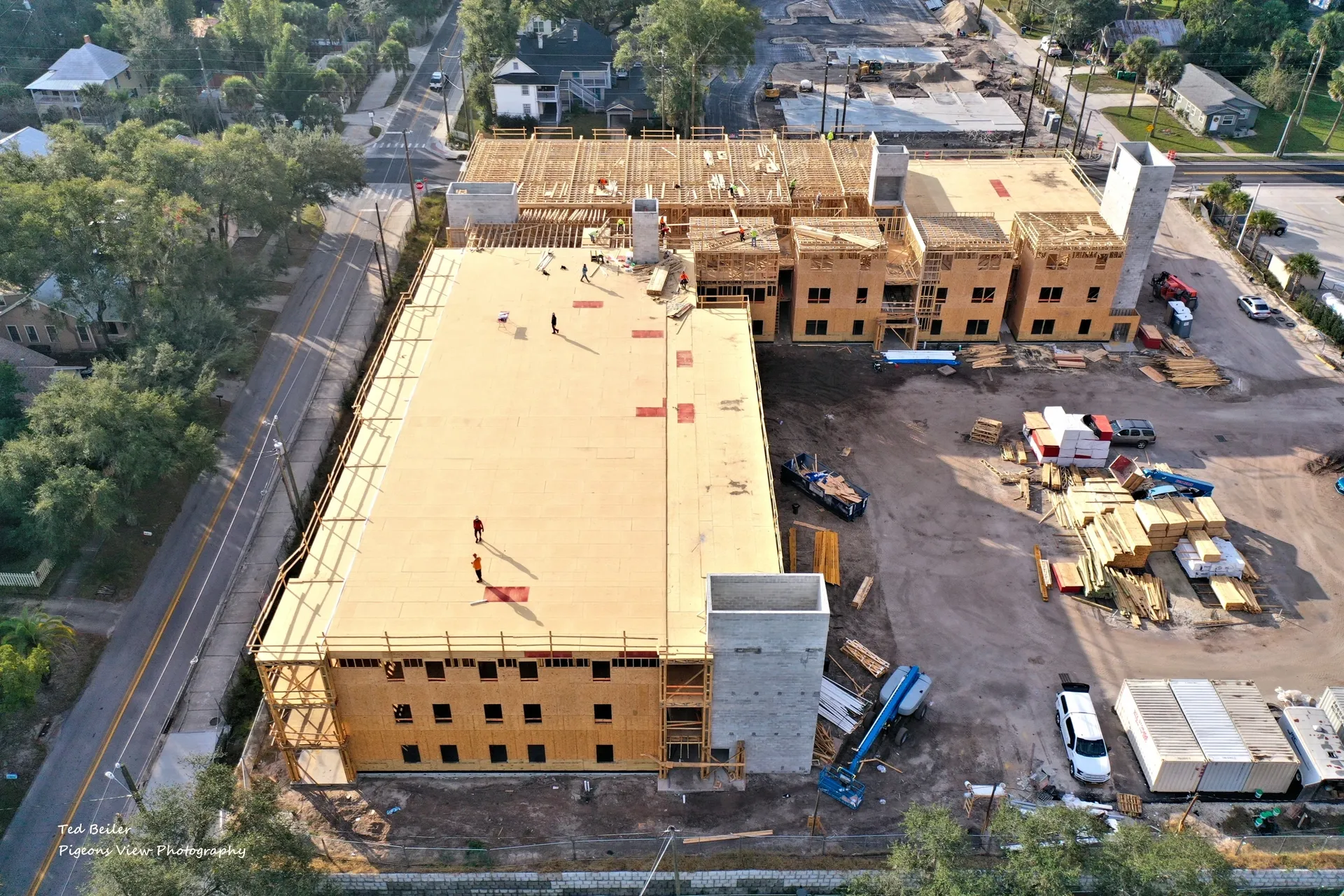 Workers on construction site rooftop