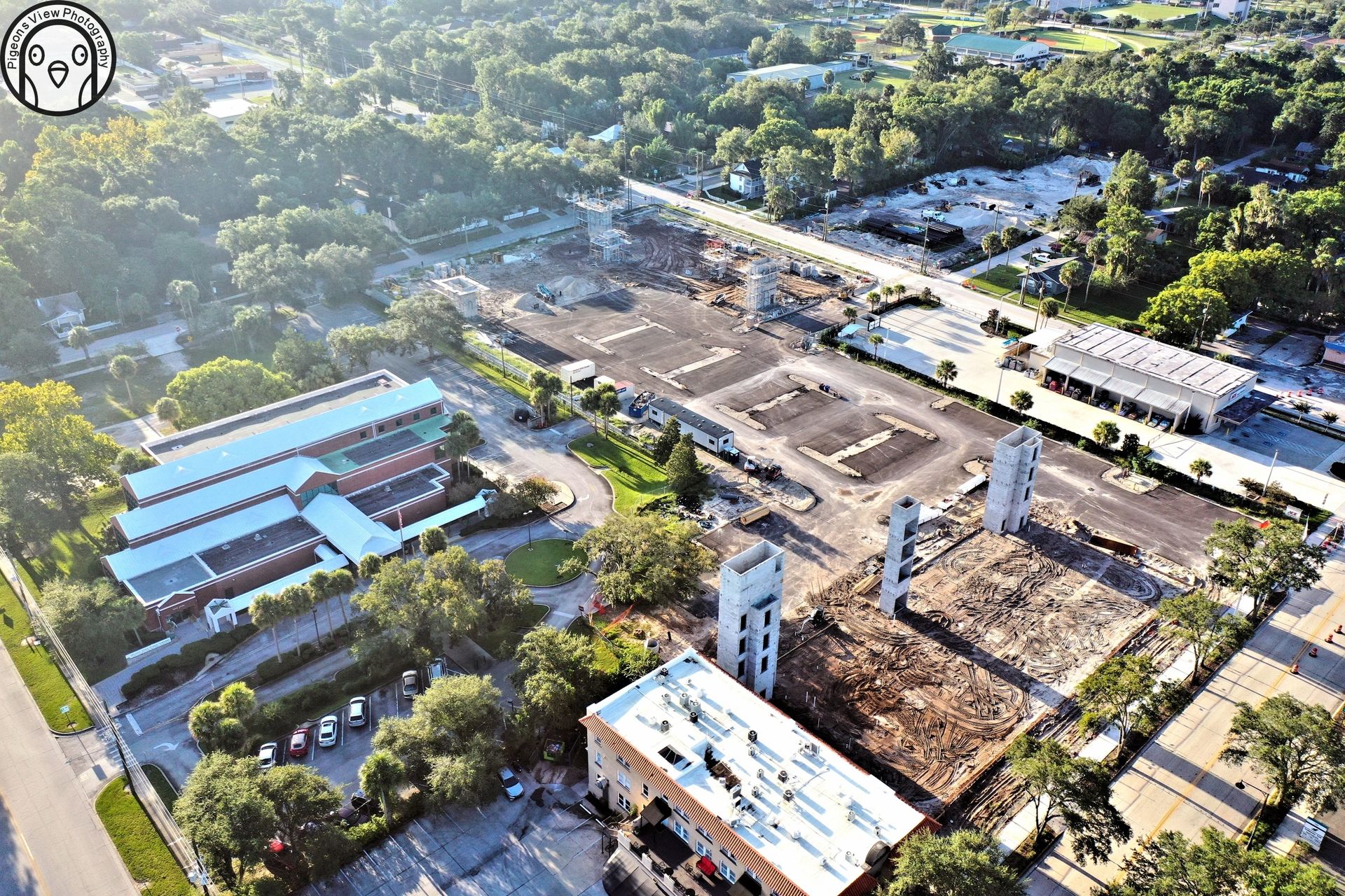 Aerial view of construction site and greenery.