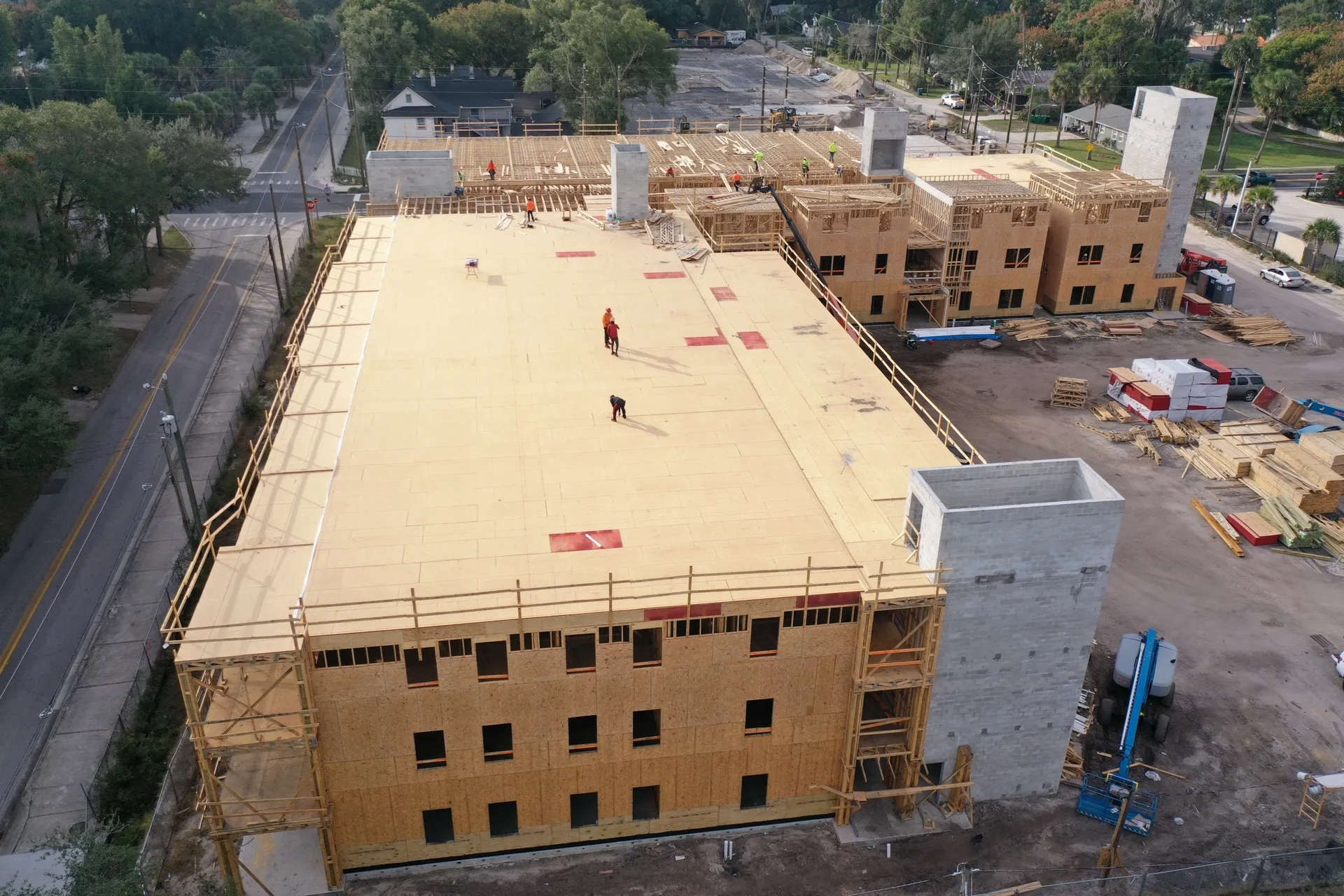 Workers on a large building under construction