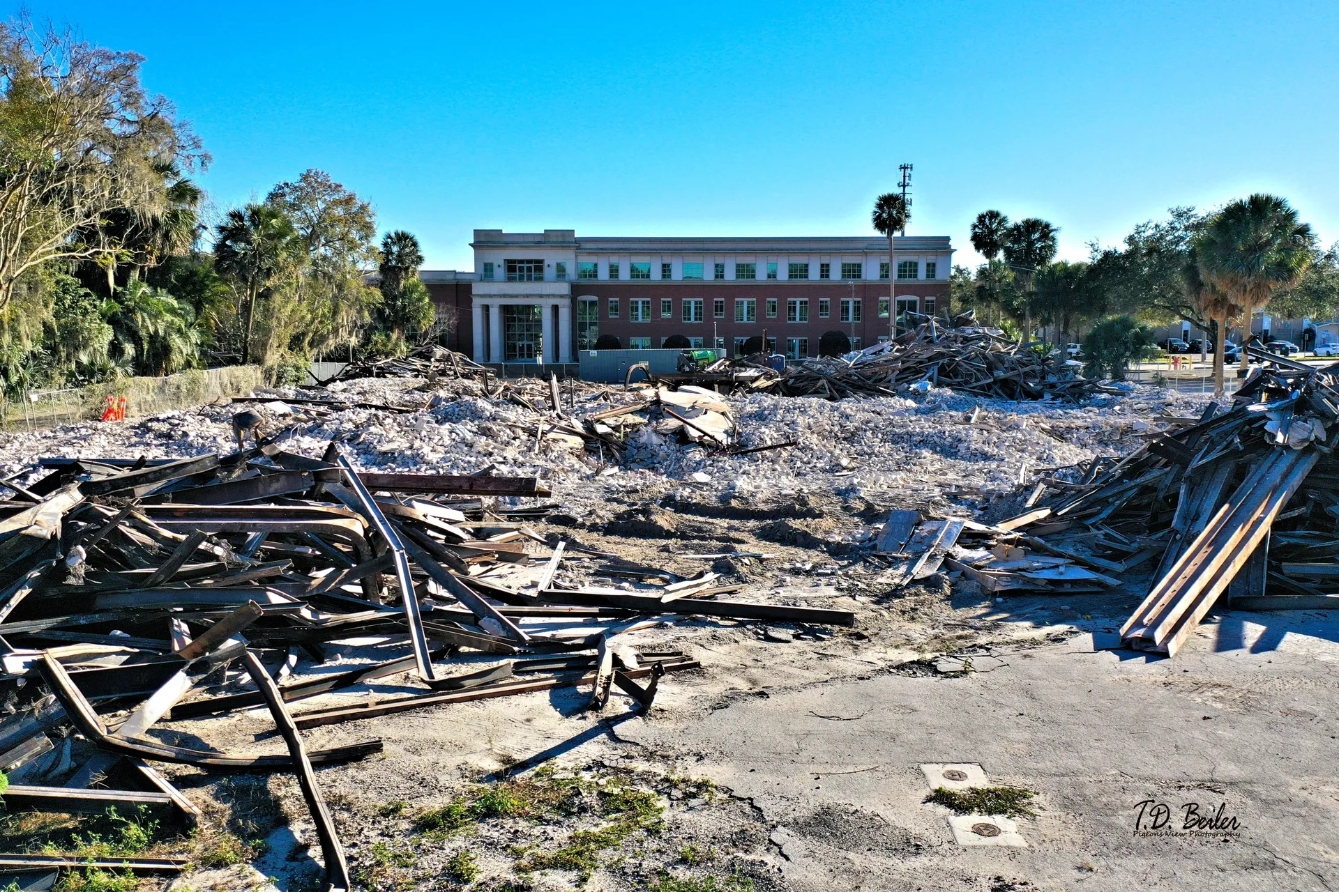 Demolition site with debris and building