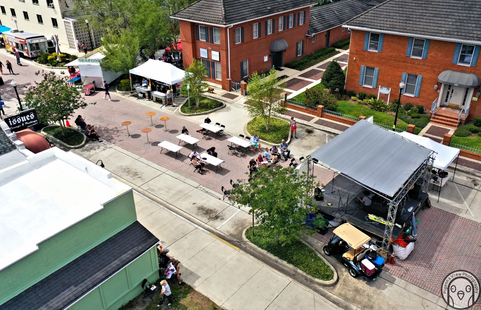 Outdoor community event with tents and seating