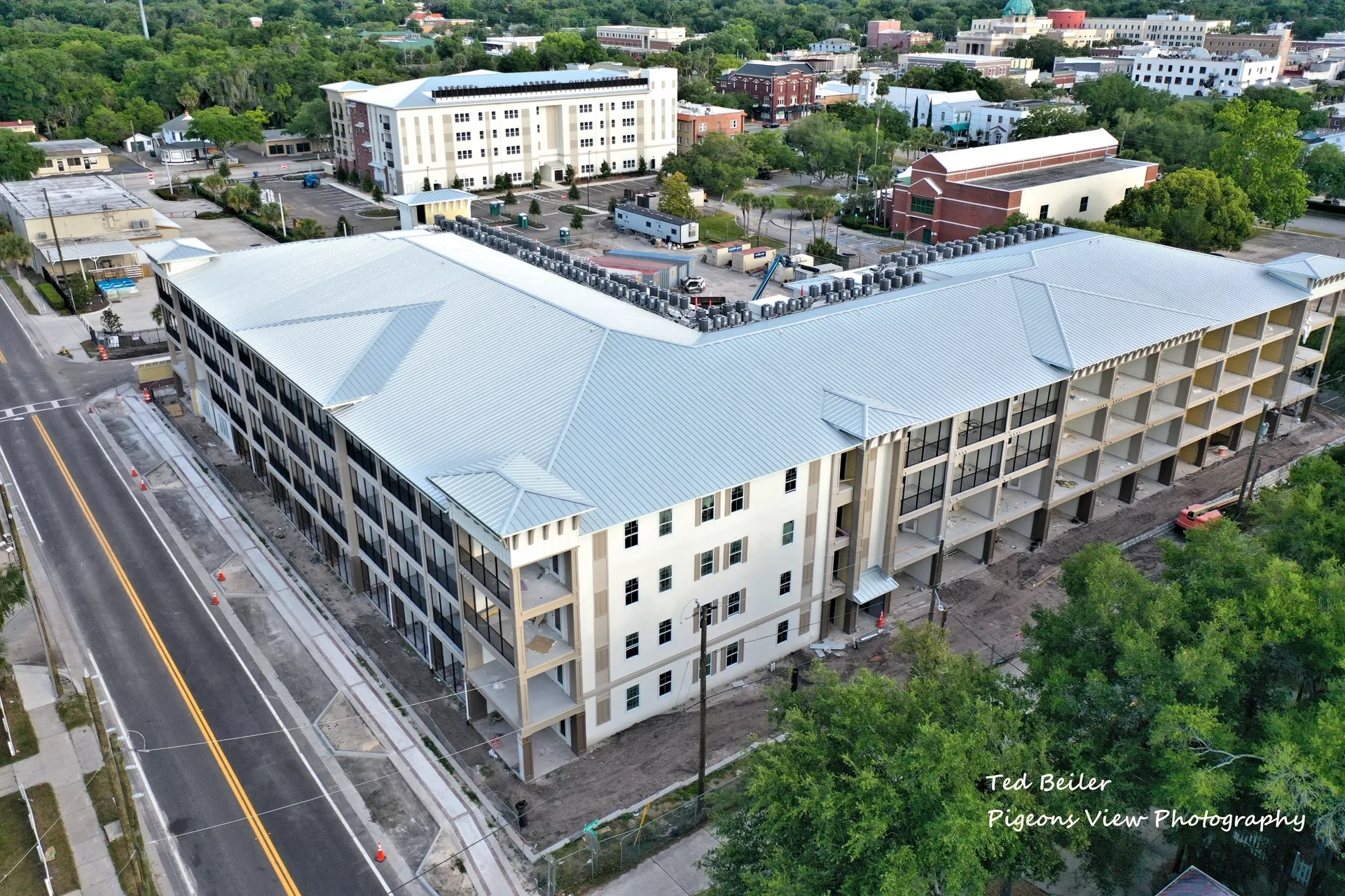 Aerial view of large building construction site.