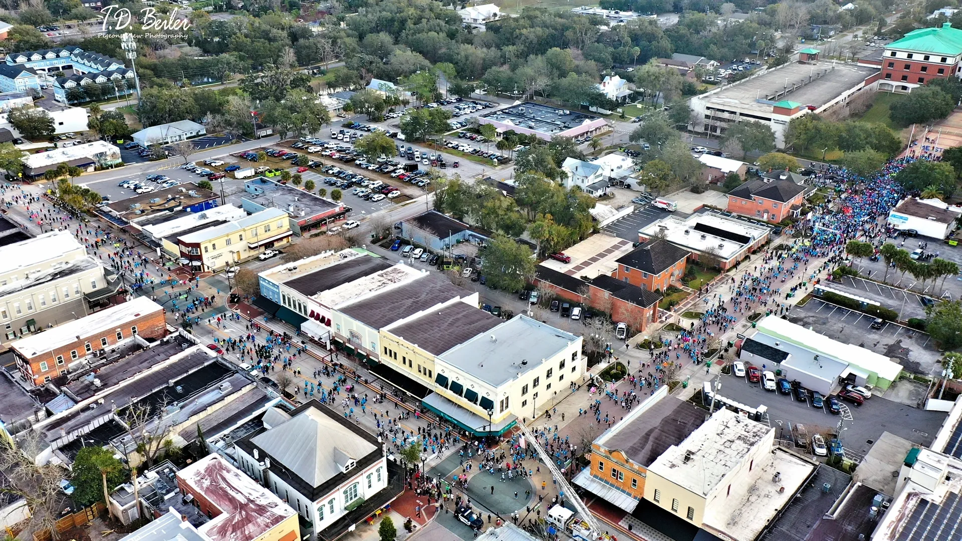 Crowds gather in a vibrant urban area