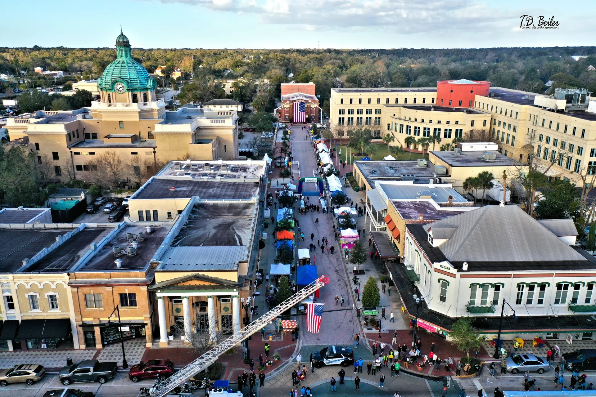 Colorful market stalls line the street.