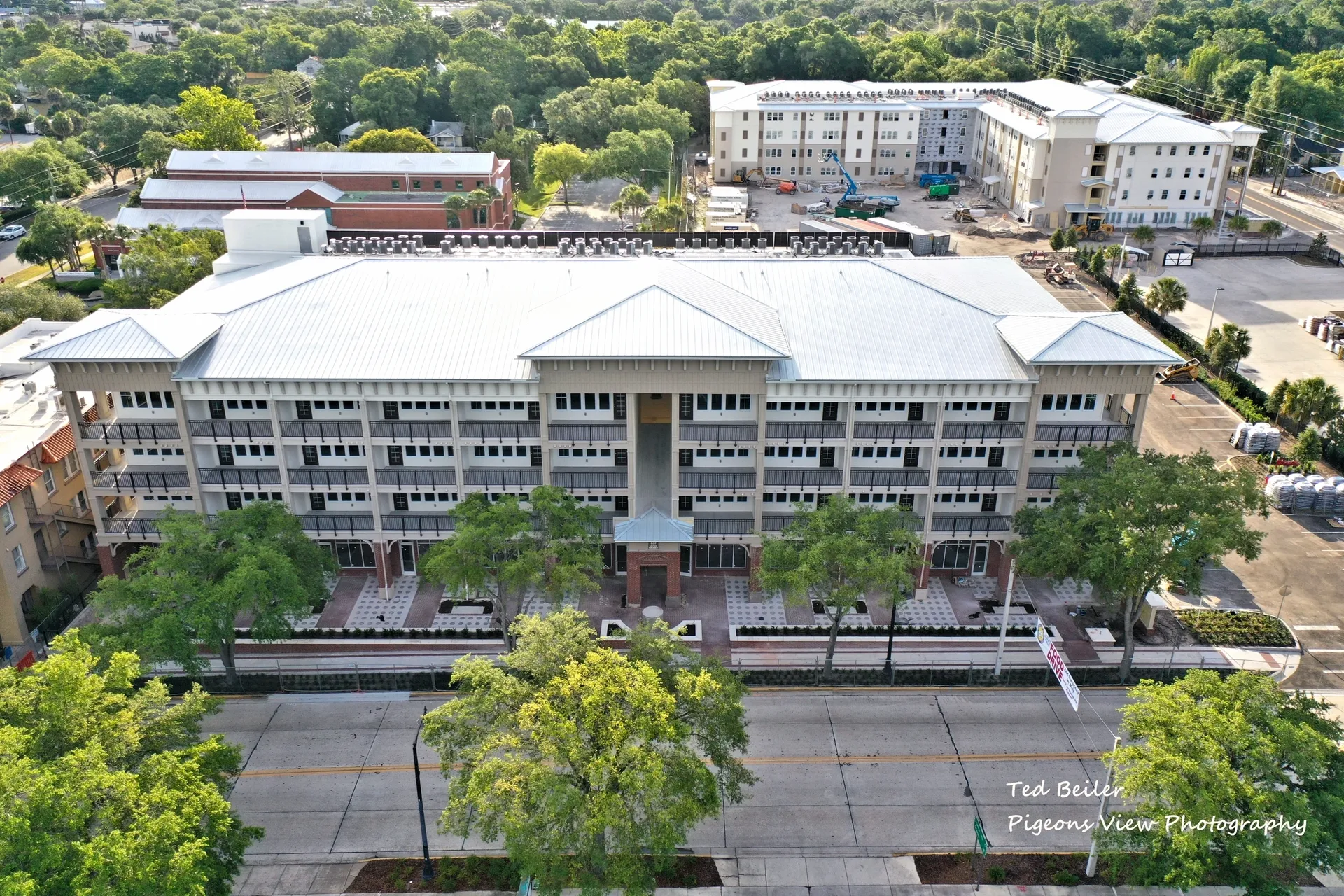 Aerial view of large building and trees