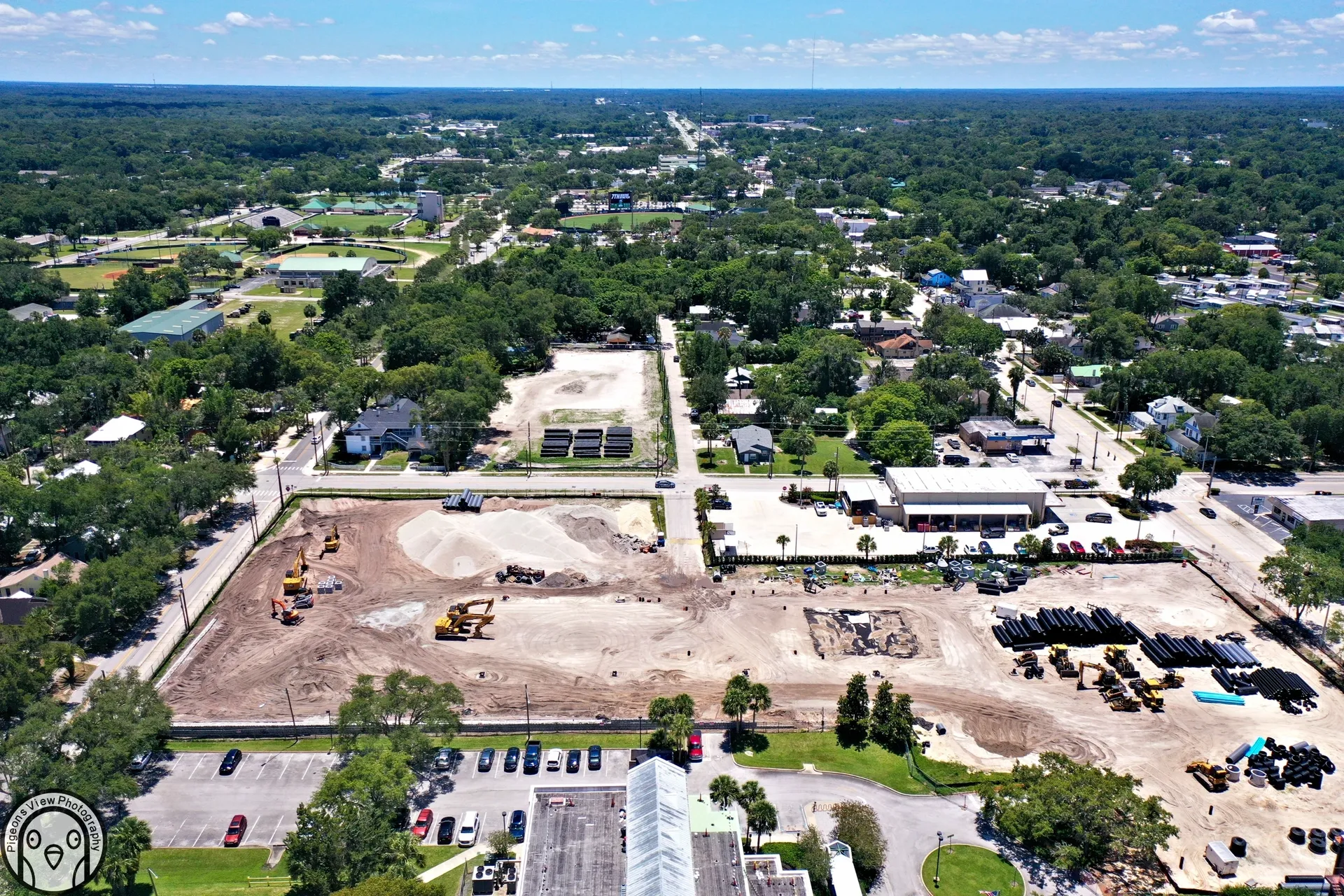 Urban development with machinery and trees