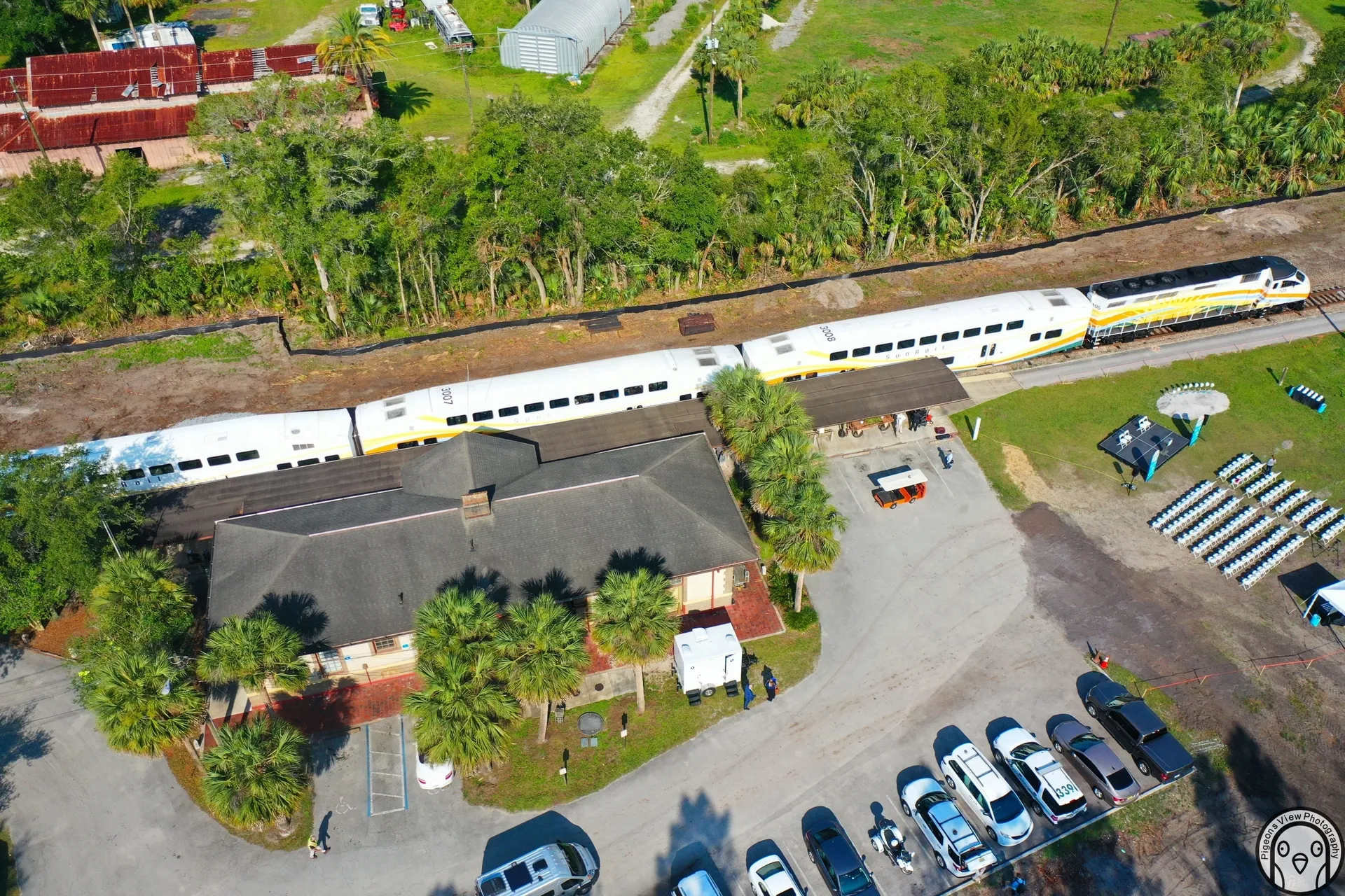 Train passing by a rural station