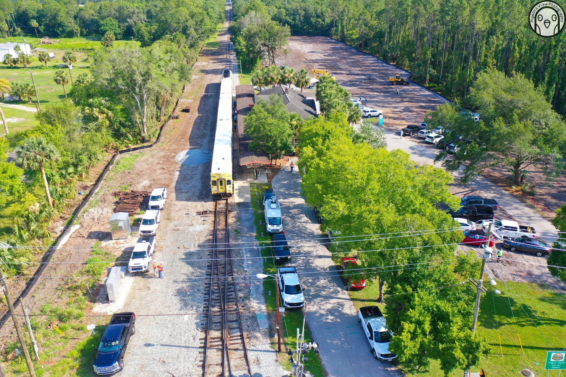 Train on tracks surrounded by trees